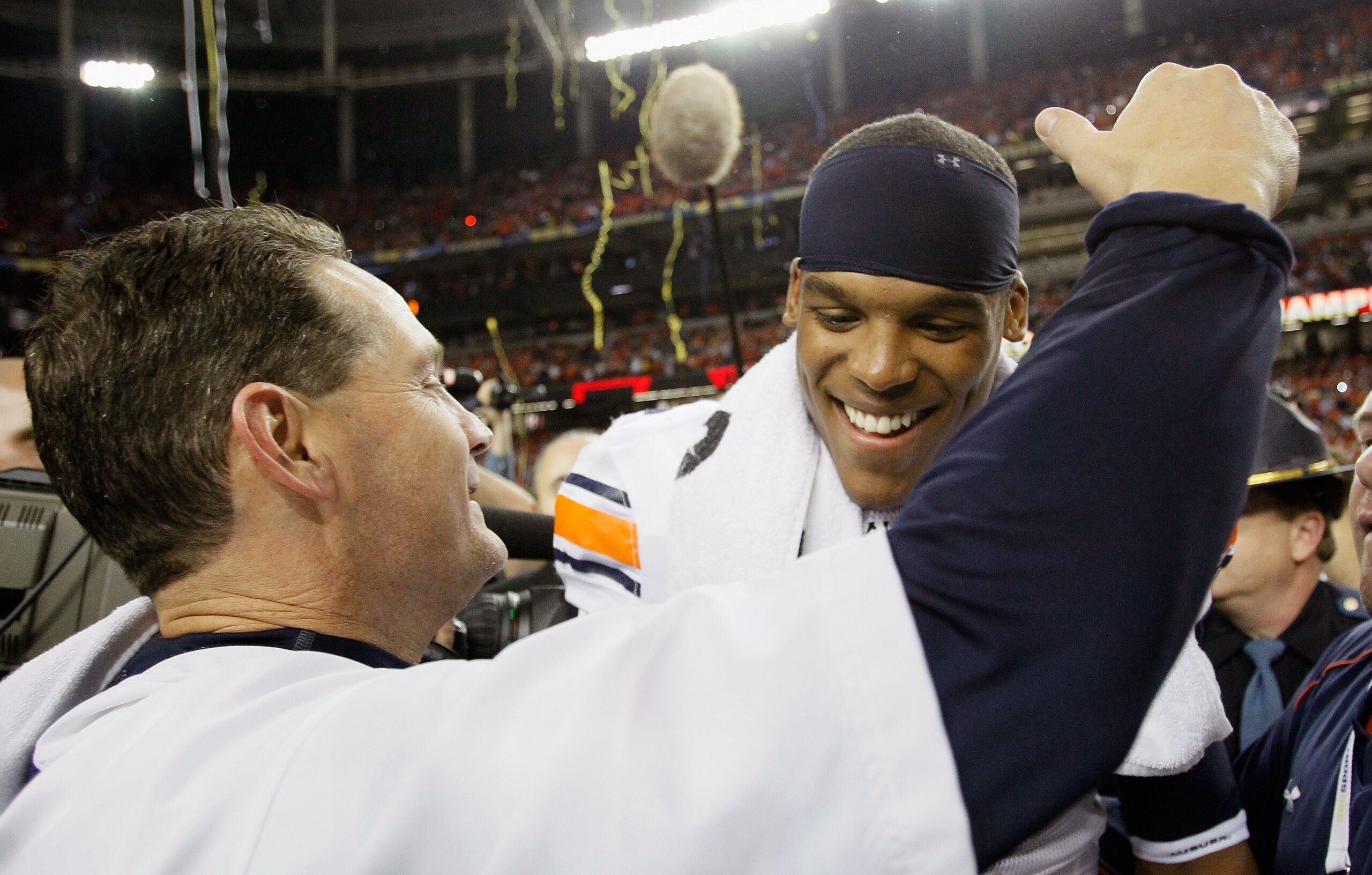 ATLANTA, GA - DECEMBER 04:  Quarterback Cam Newton #2 of the Auburn Tigers celebrates with head coach Gene Chizik after their 56-17 win over the South Carolina Gamecocks during the 2010 SEC Championship at Georgia Dome on December 4, 2010 in Atlanta, Geor