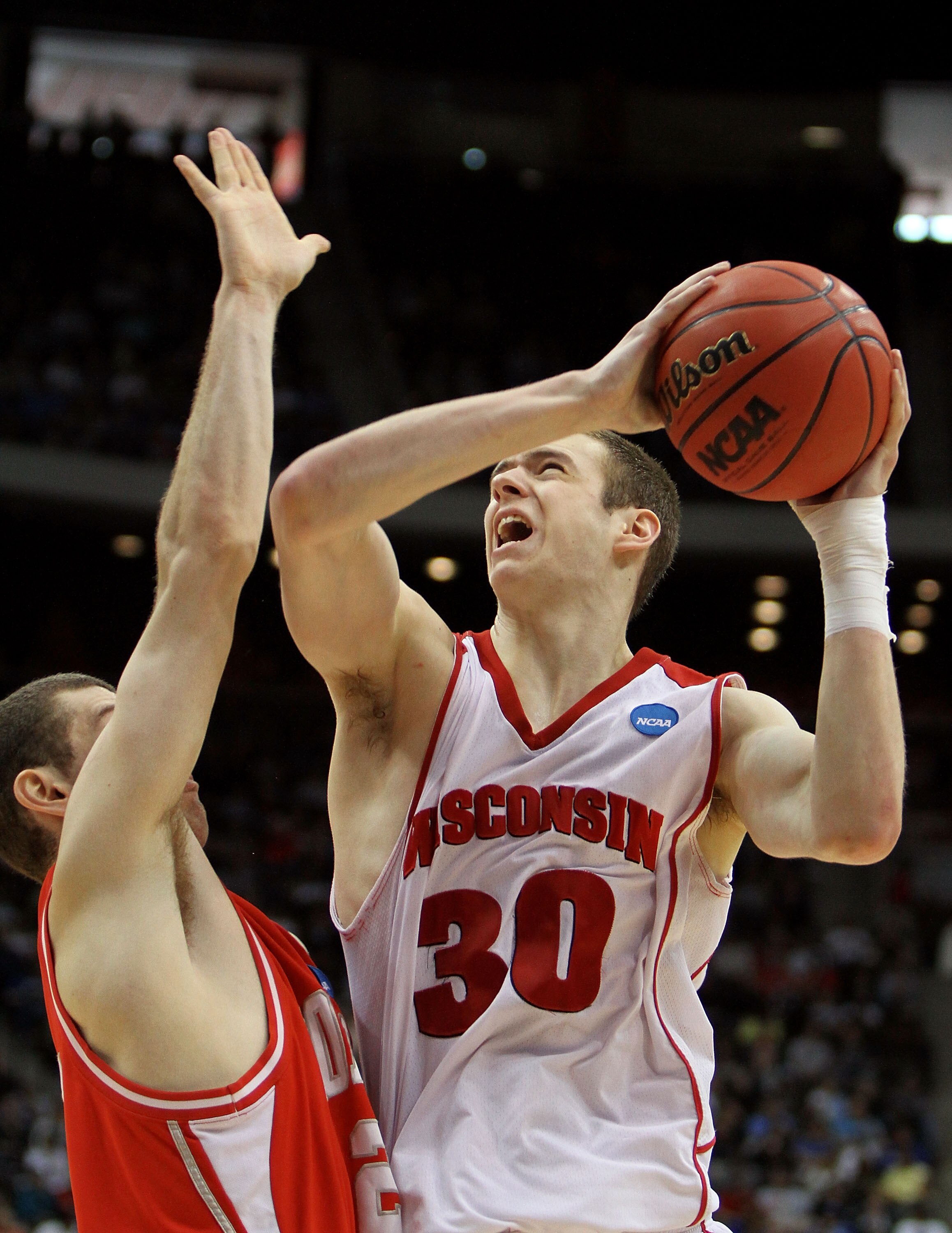JACKSONVILLE, FL - MARCH 21:  Jon Leuer #30 of the Cornell Big Red drives over Jon Jaques #25 of the Wisconsin Badgers during the second round of the 2010 NCAA men's basketball tournament at Jacksonville Veteran's Memorial Arena on March 21, 2010 in Jacks