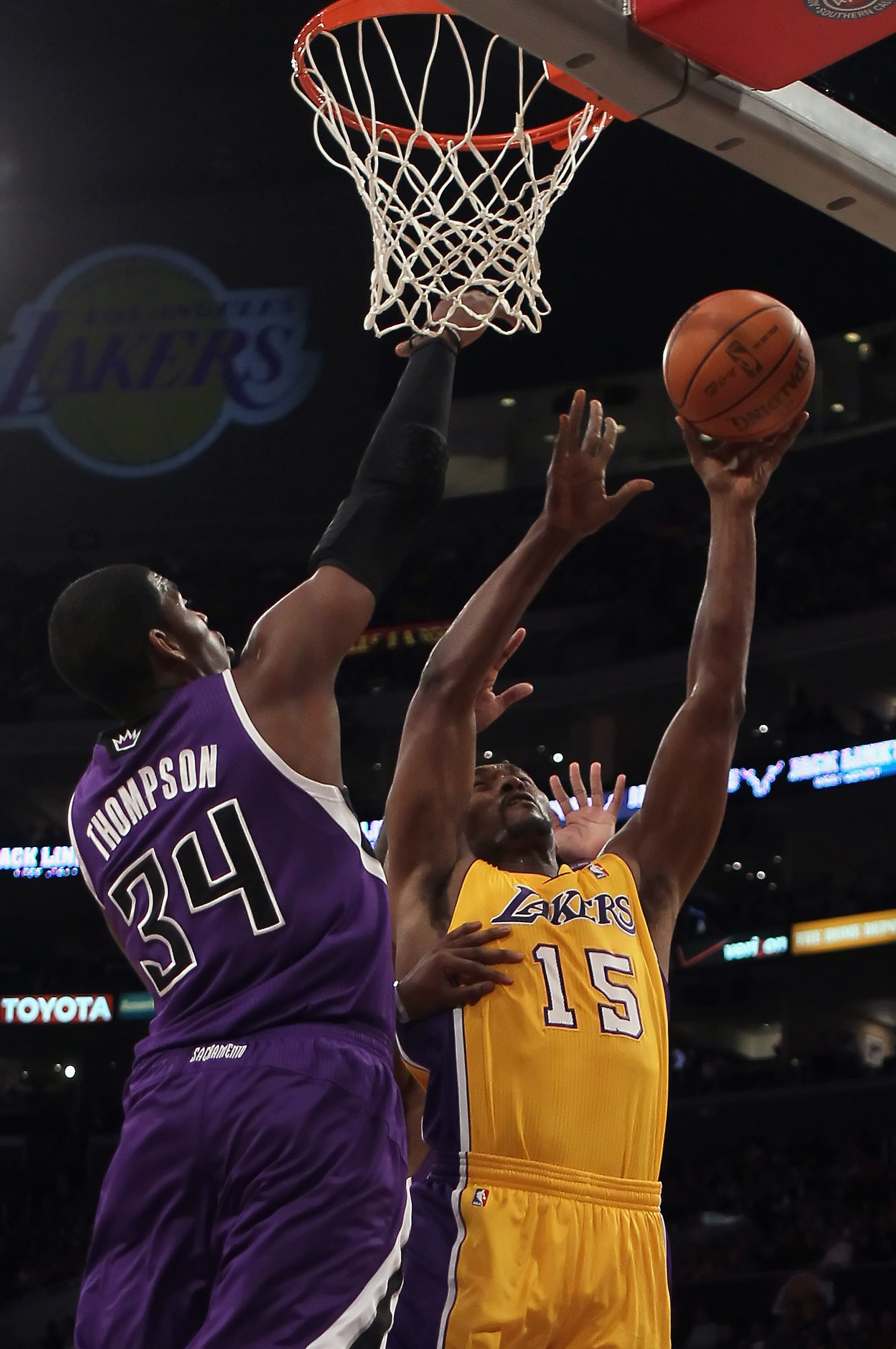 LOS ANGELES, CA - DECEMBER 03:  Ron Artest #15 of the Los Angeles Lakers drives to the basket while being defended by Jason Thompson #34 of the Sacramento Kings during the first half at Staples Center on December 3, 2010 in Los Angeles, California. The La