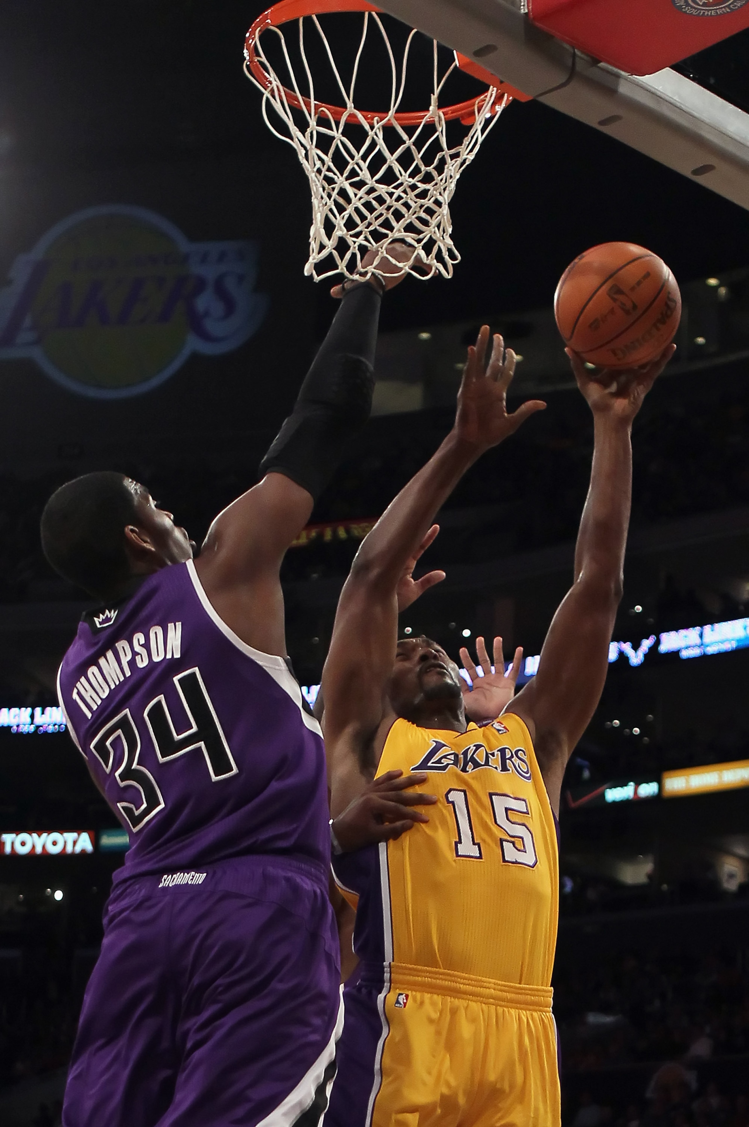 LOS ANGELES, CA - DECEMBER 03:  Ron Artest #15 of the Los Angeles Lakers drives to the basket while being defended by Jason Thompson #34 of the Sacramento Kings during the first half at Staples Center on December 3, 2010 in Los Angeles, California. The La