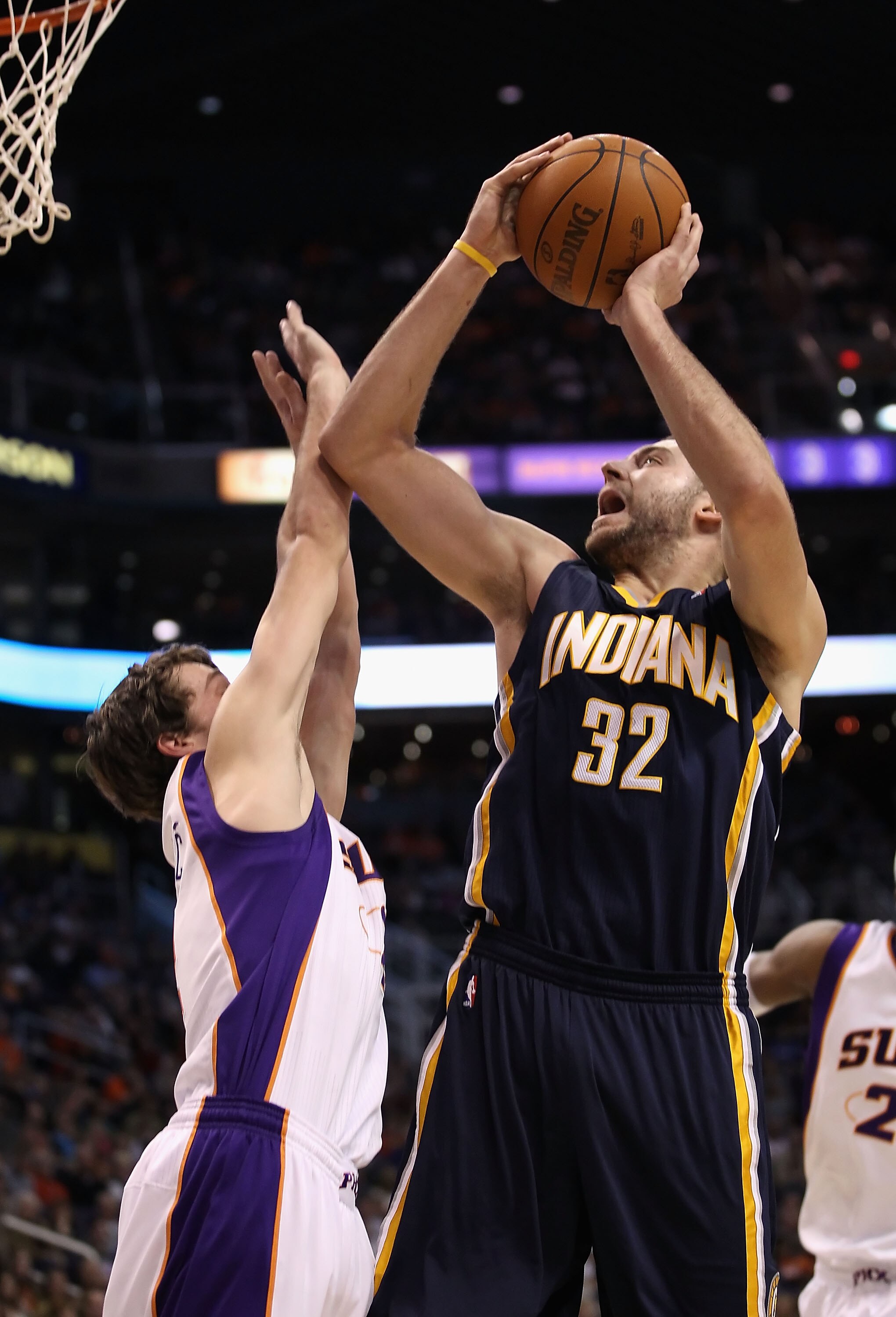 PHOENIX - DECEMBER 03:  Josh McRoberts #32 of the Indiana Pacers puts up a shot over Goran Dragic #2 of the Phoenix Suns during the NBA game at US Airways Center on December 3, 2010 in Phoenix, Arizona. NOTE TO USER: User expressly acknowledges and agrees