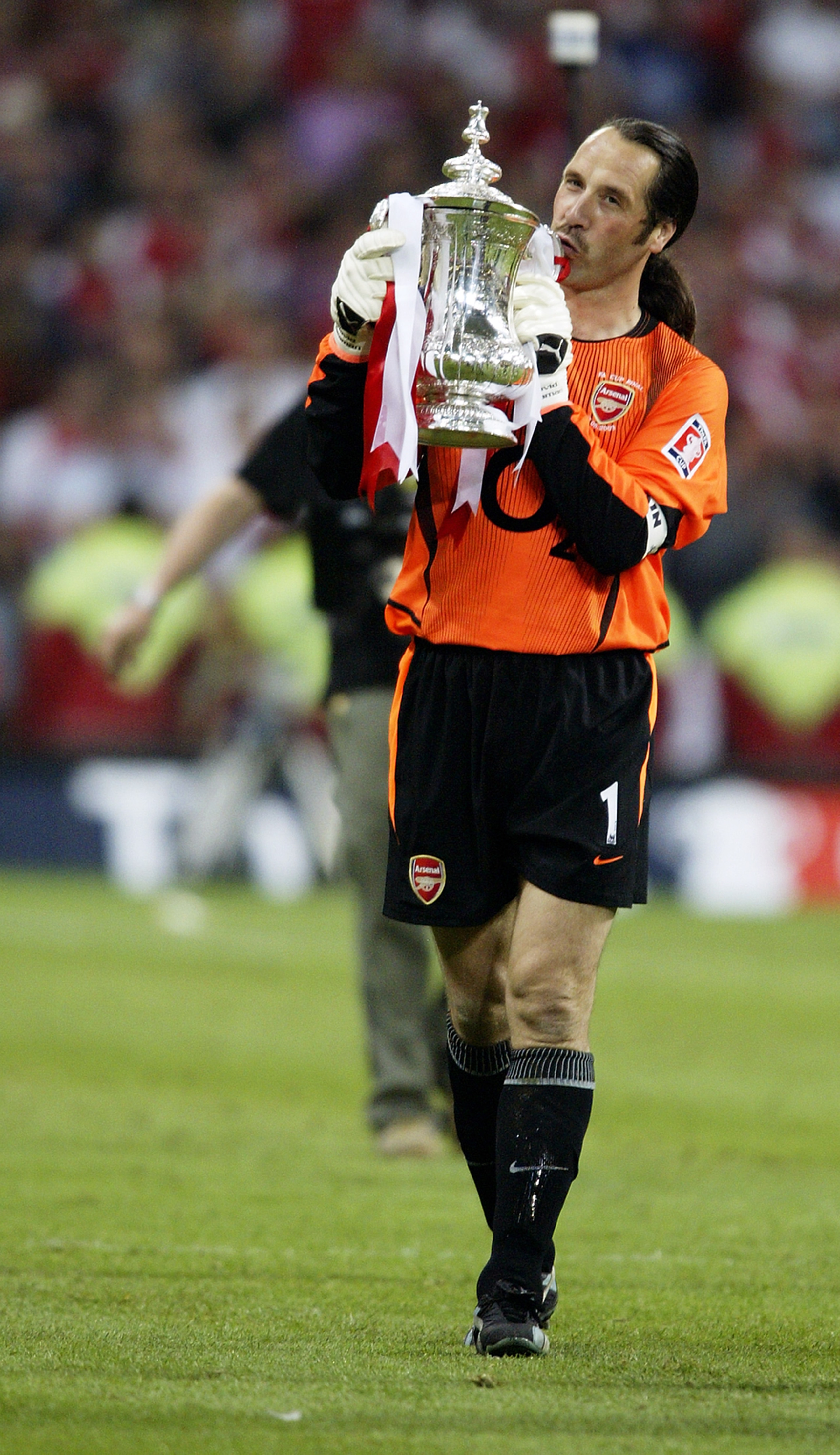 CARDIFF - MAY 17:  David Seaman of Arsenal celebrates with the FA Cup after winning the FA Cup Final match between Arsenal and Southampton on May 17, 2003 at the Millennium Stadium in Cardiff, Wales. David Seaman, who was capped 75 times for England, anno