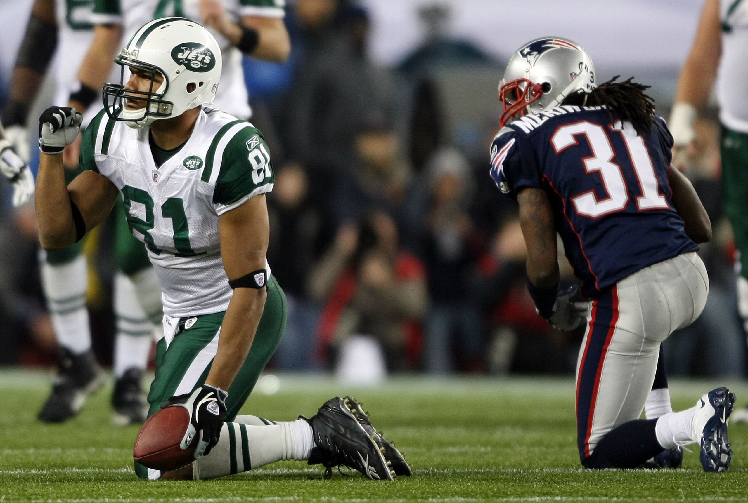 FOXBORO, MA - NOVEMBER 13: Dustin Keller #81 of the New York Jets celebrates the first down in the overtime quarter as Brandon Meriweather #31 of the New England Patriots kneels nearby on November 13, 2008 at Gillette Stadium in Foxboro, Massachusetts. T FOXBORO, MA - NOVEMBER 13: Dustin Keller #81 of the New York Jets celebrates the first down in the overtime quarter as Brandon Meriweather #31 of the New England Patriots kneels nearby on November 13, 2008 at Gillette Stadium in Foxboro, Massachusetts. T