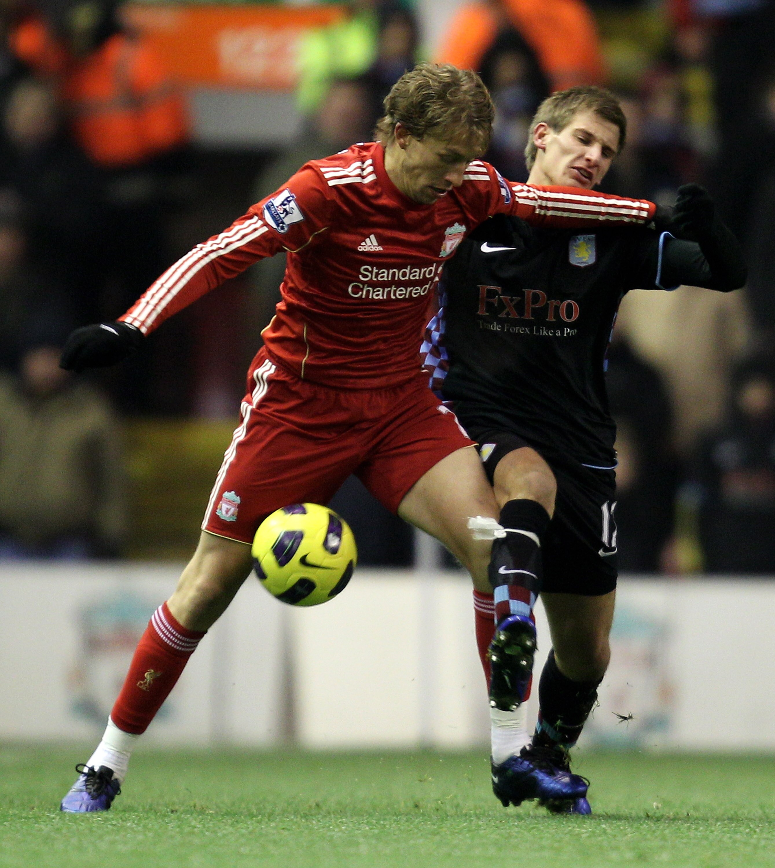 LIVERPOOL, ENGLAND - DECEMBER 06:  Marc Albrighton of Aston Villa tangles with Lucas of Liverpool during the Barclays Premier League match between Liverpool and Aston Villa at Anfield on December 6, 2010 in Liverpool, England.  (Photo by Mark Thompson/Get