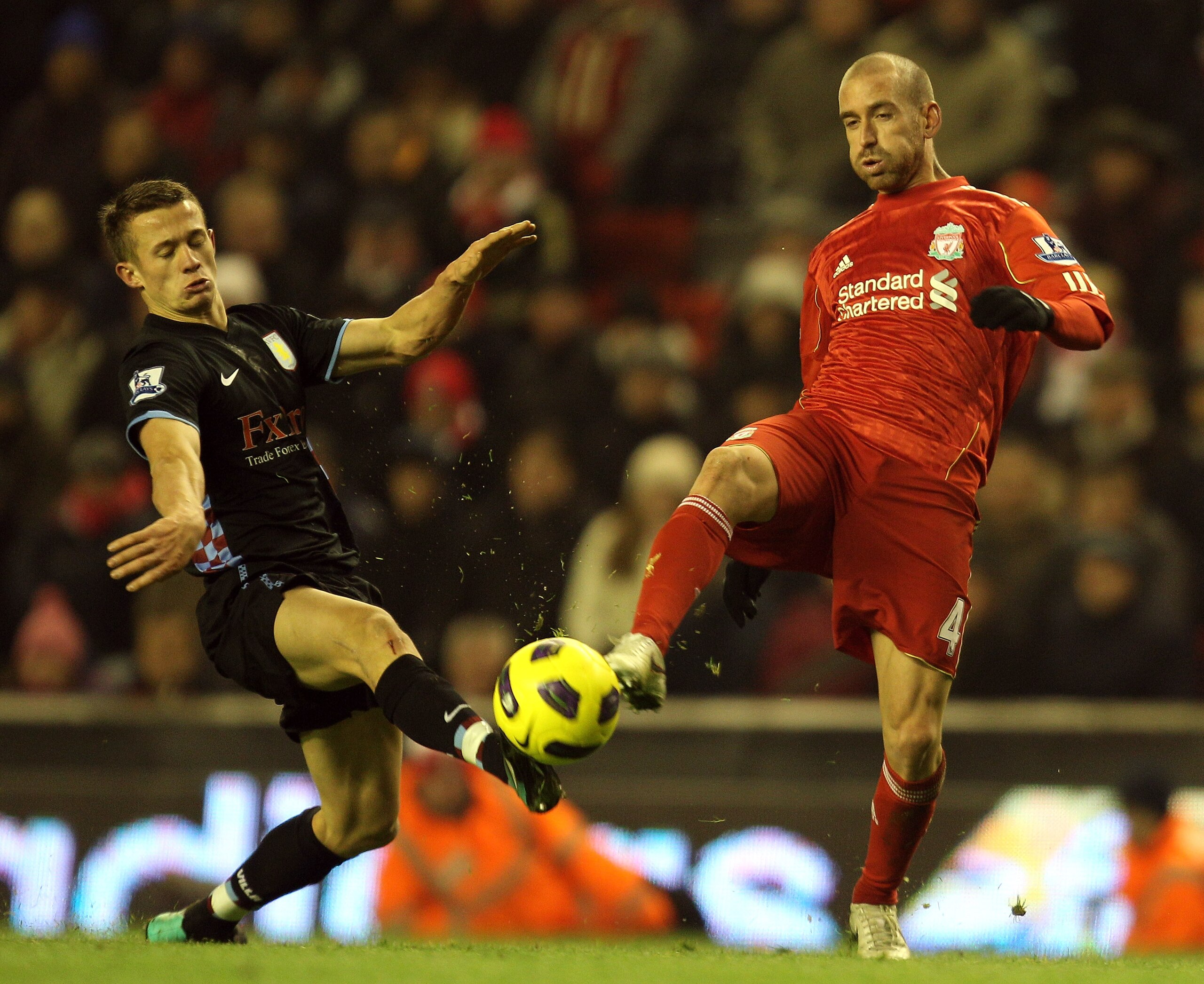 LIVERPOOL, ENGLAND - DECEMBER 06:  Jonathan Hogg of Aston Villa competes with Raul Meireles of Liverpool during the Barclays Premier League match between Liverpool and Aston Villa at Anfield on December 6, 2010 in Liverpool, England. (Photo by Mark Thomps
