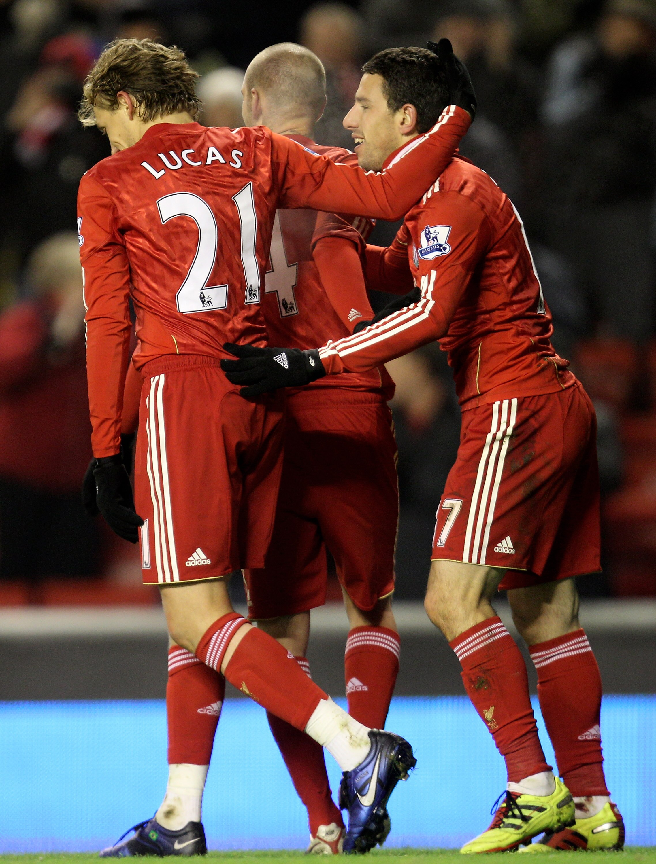 LIVERPOOL, ENGLAND - DECEMBER 06:   Maxi Rodriguez of Liverpool is congratulated by team mate Lucas after scoring his team's third goal during the Barclays Premier League match between Liverpool and Aston Villa at Anfield on December 6, 2010 in Liverpool,