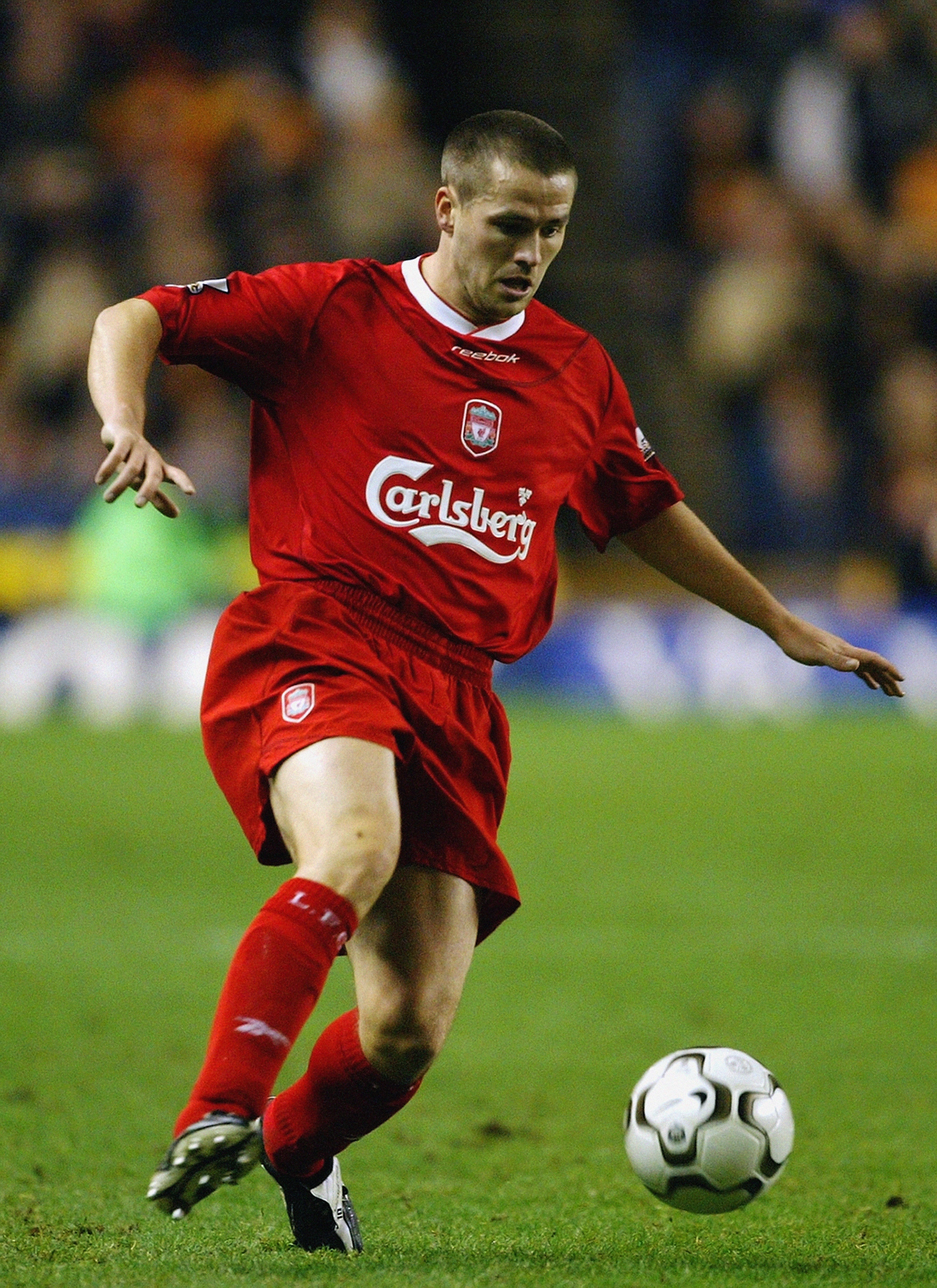 WOLVERHAMPTON - JANUARY 21:  Michael Owen of Liverpool takes control of the ball during the FA Barclaycard Premiership match between Wolverhampton Wanderers and Liverpool on January 21, 2004 at Molineux Stadium in Wolverhampton, England.  The match finish