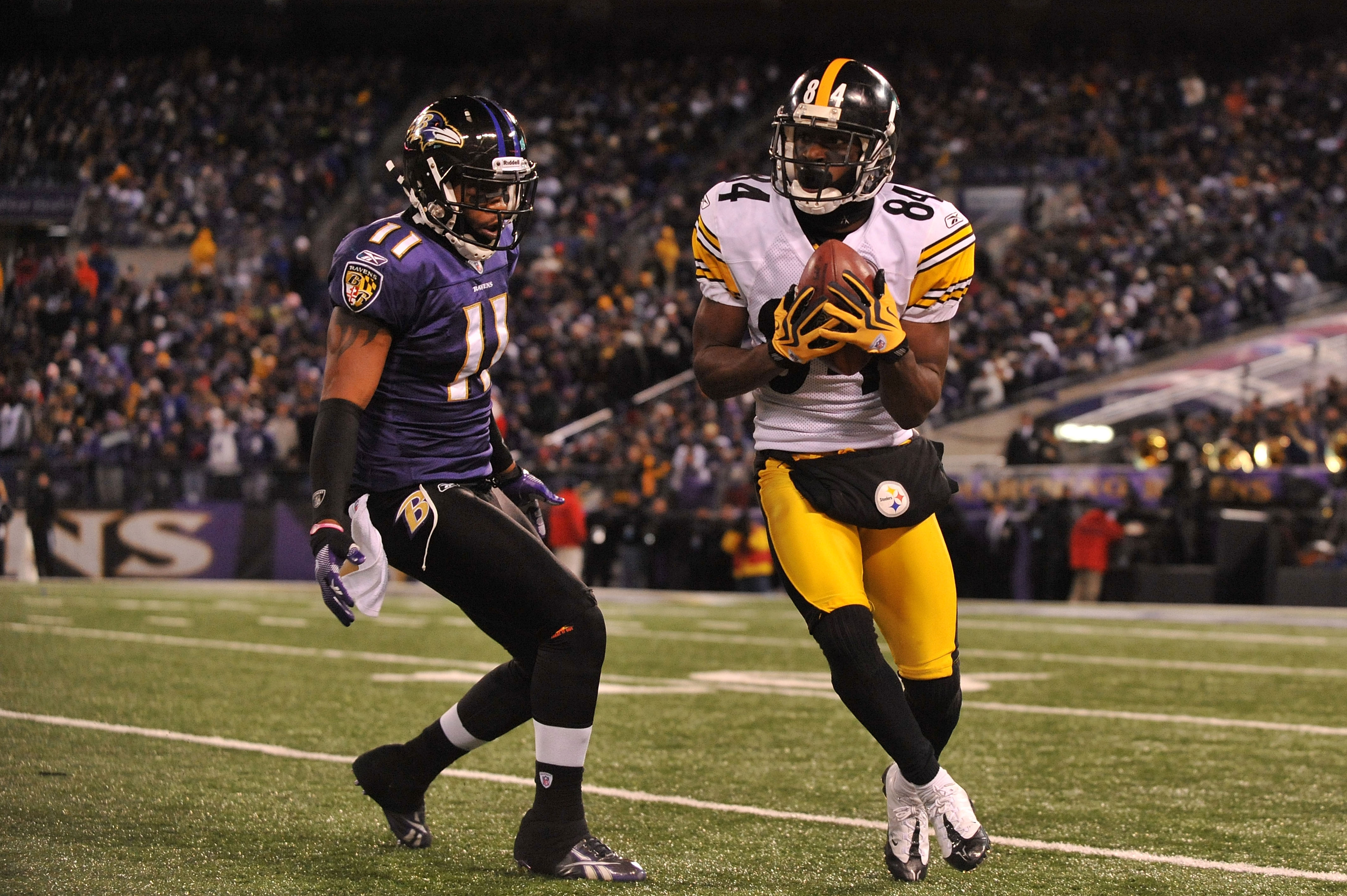 BALTIMORE, MD - DECEMBER 05:  Wide receiver Antonio Brown #84 of the Pittsburgh Steelers catches the ball against wide receiver Marcus Smith #11 of the the Baltimore Ravens during the fourth quarter of the game at M&T Bank Stadium on December 5, 2010 in B