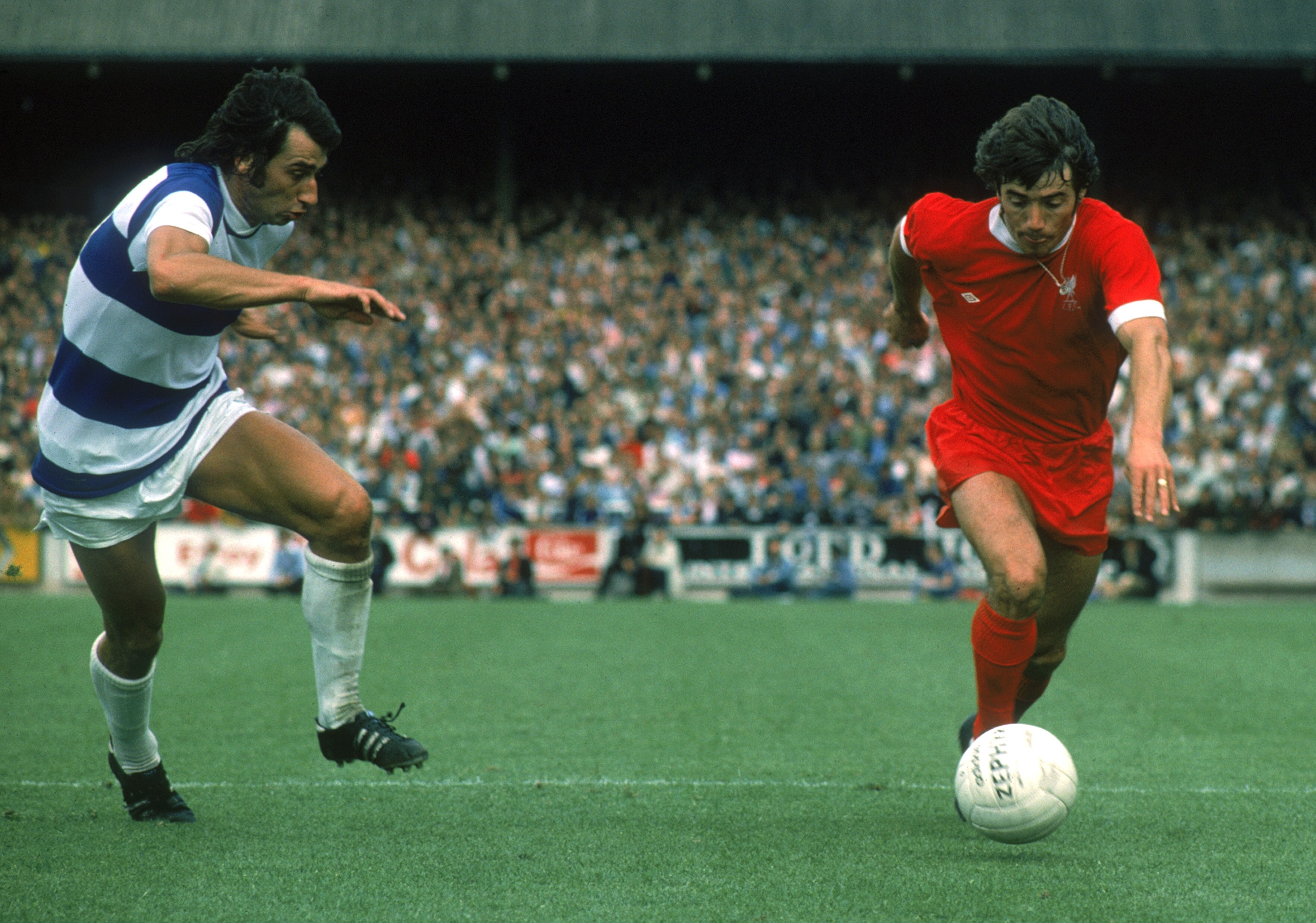 LONDON - AUGUST 16:  Kevin Keegan of Liverpool looks to take the ball past Dave Clement of Queens Park Rangers during the League Division One match held on August 16, 1975 at Loftus Road, in London. Queens Park Rangers won the match 2-0. (Photo by Don Mor