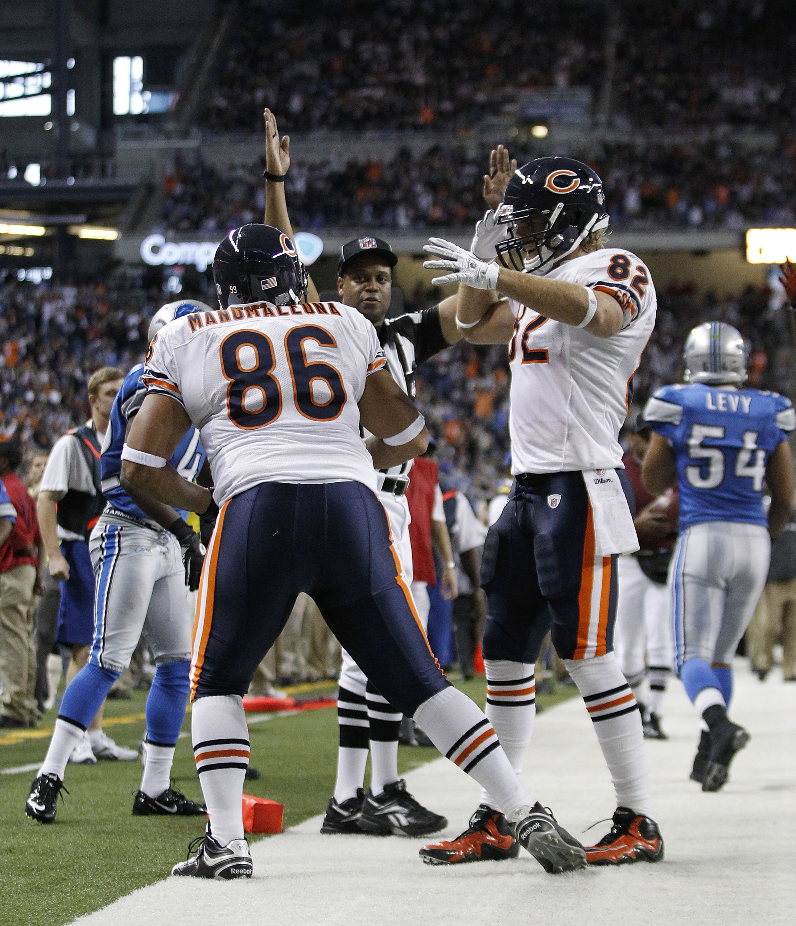 DETROIT - DECEMBER 05:  Brandon Manumaleuna #86 of the Chicago Bears celebrates a fourth quarter touchdown with teammate Greg Olsen #82 during the game against the Detroit Lions at Ford Field on December 5, 2010 in Detroit, Michigan. The Bears defeated th