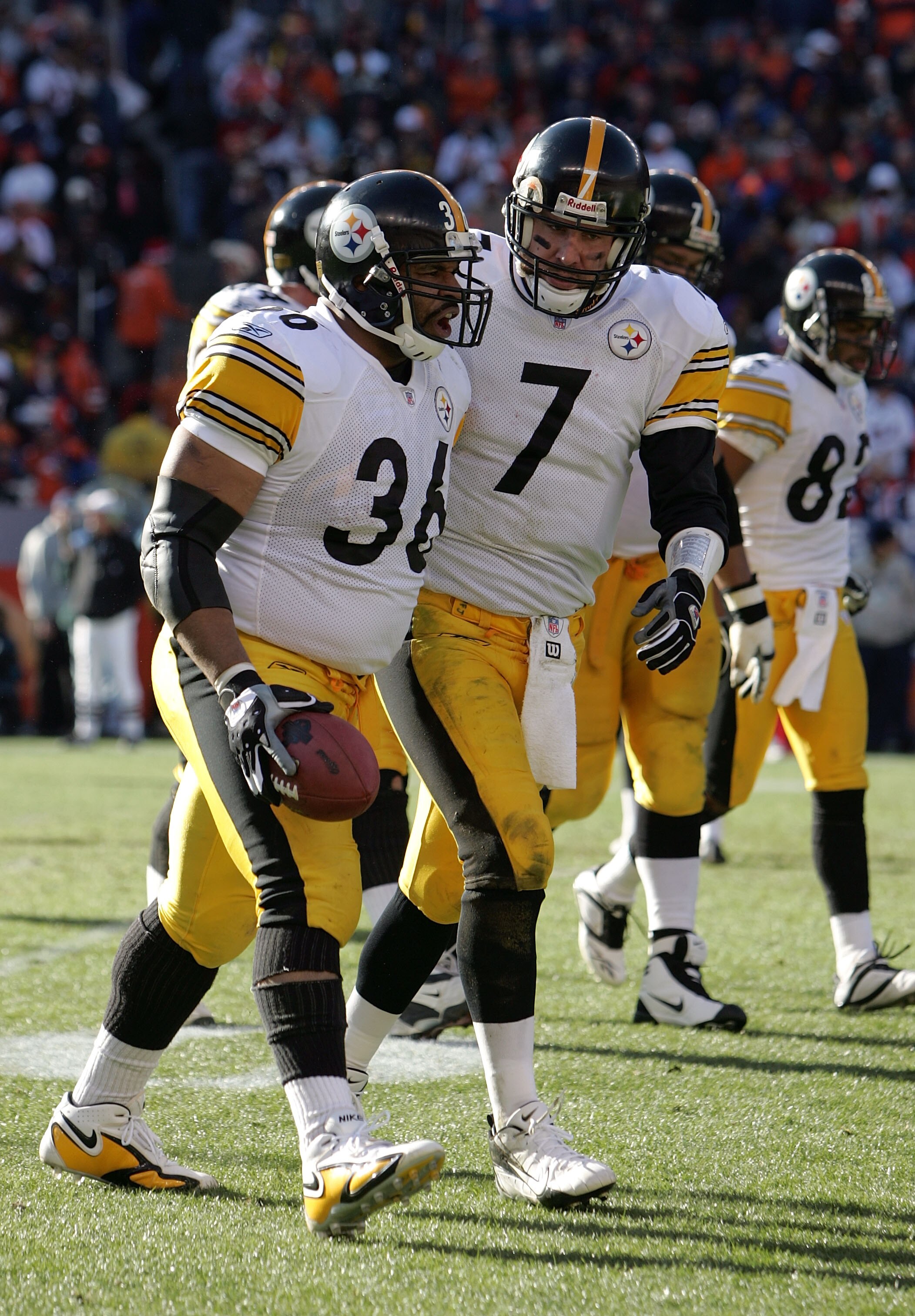 DENVER - JANUARY 22:  Jerome Bettis #36 and Ben Roethlisberger #7 of the Pittsburgh Steelers celebrate as the run off the field after Bettis scored a touchdown against the Denver Broncos during the AFC Championship Game January 22, 2006 at Invesco Field a