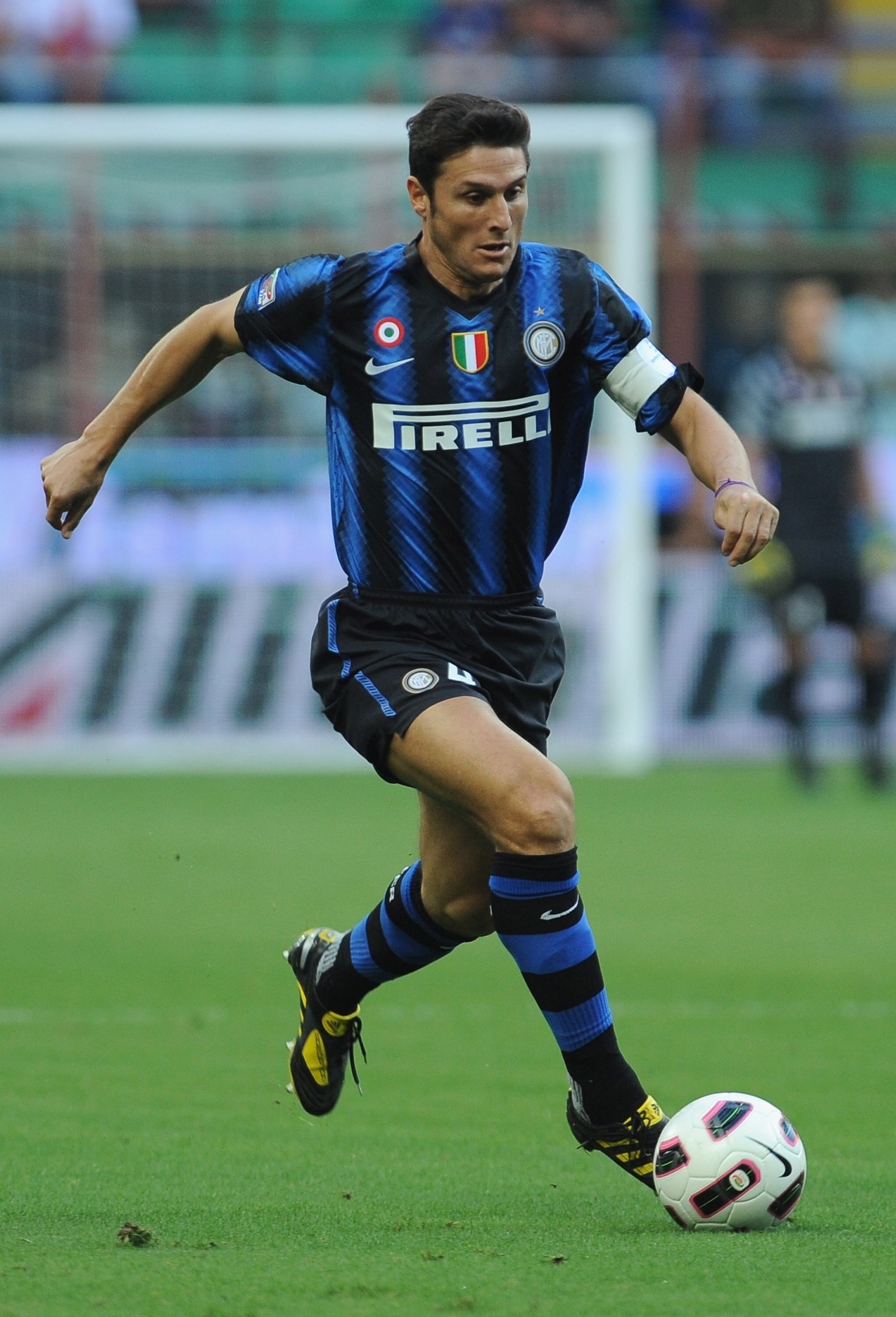 MILAN, ITALY - SEPTEMBER 11:  Javier Zanetti  of FC Internazionale in action during the Serie A match between FC Internazionale and Udinese Calcio at Stadio Giuseppe Meazza on September 11, 2010 in Milan, Italy.  (Photo by Valerio Pennicino/Getty Images)