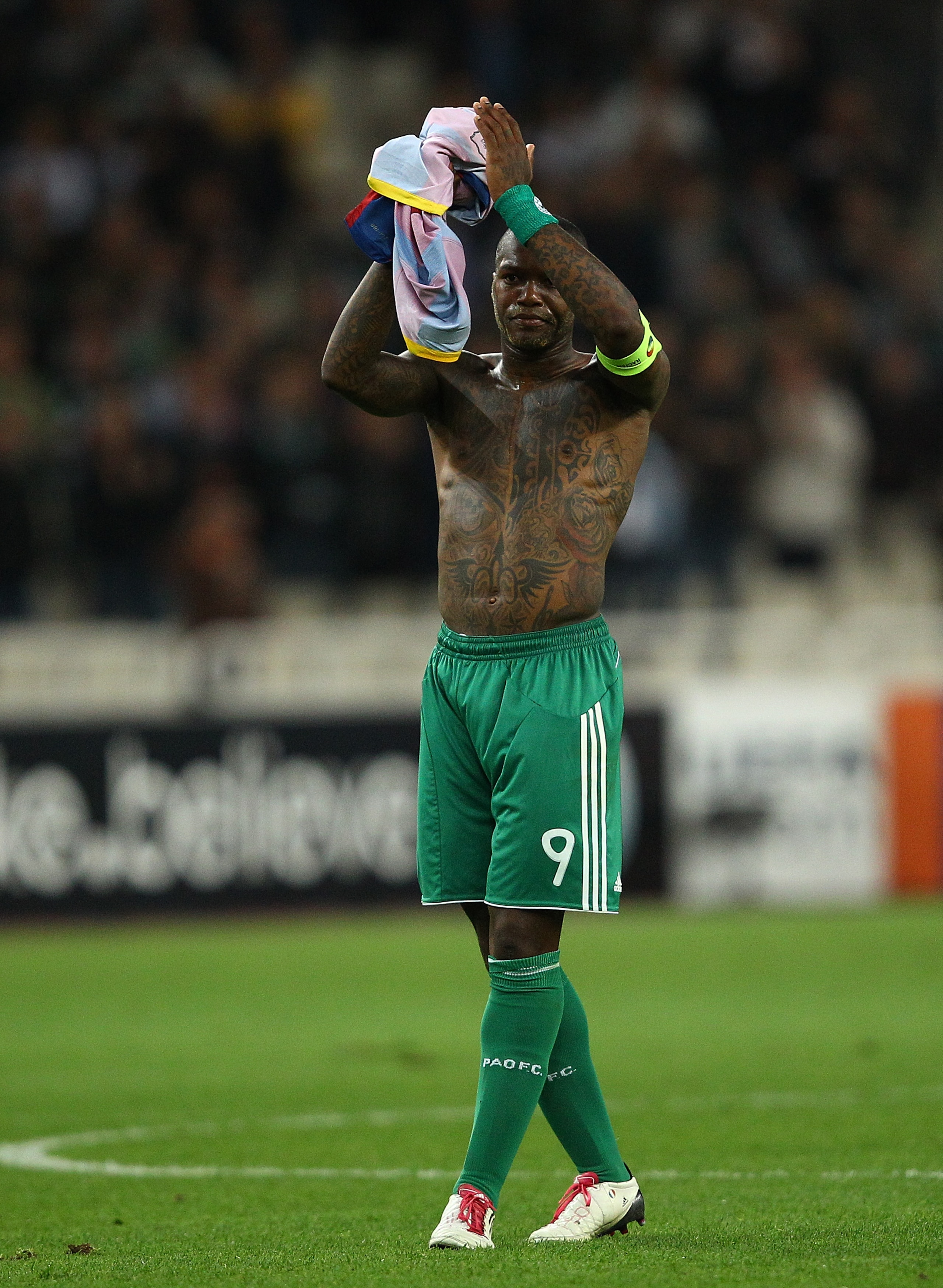 ATHENS, GREECE - NOVEMBER 24:  Djibril Cisse of Panathinaikos acknowledges the fans after the UEFA Champions League Group D match between Panathinaikos FC and FC Barcelona at OAKA Spiros Louis Stadium on November 24, 2010 in Athens, Greece.  (Photo by Vla