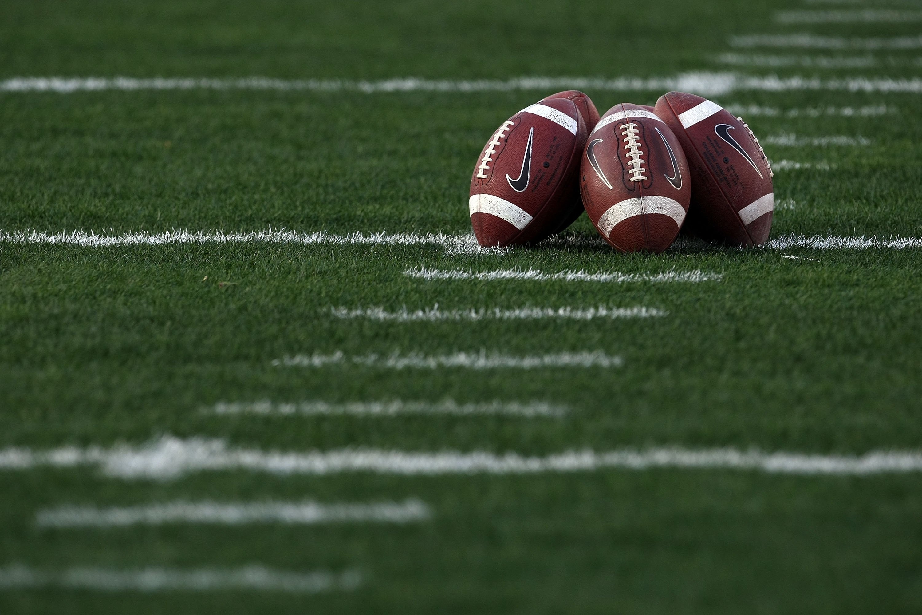 PASADENA, CA - JANUARY 07: A detailed picture of footballs on the field prior to the Citi BCS National Championship game between the Texas Longhorns and the Alabama Crimson Tide at the Rose Bowl on January 7, 2010 in Pasadena, California. (Photo by Step PASADENA, CA - JANUARY 07: A detailed picture of footballs on the field prior to the Citi BCS National Championship game between the Texas Longhorns and the Alabama Crimson Tide at the Rose Bowl on January 7, 2010 in Pasadena, California. (Photo by Step