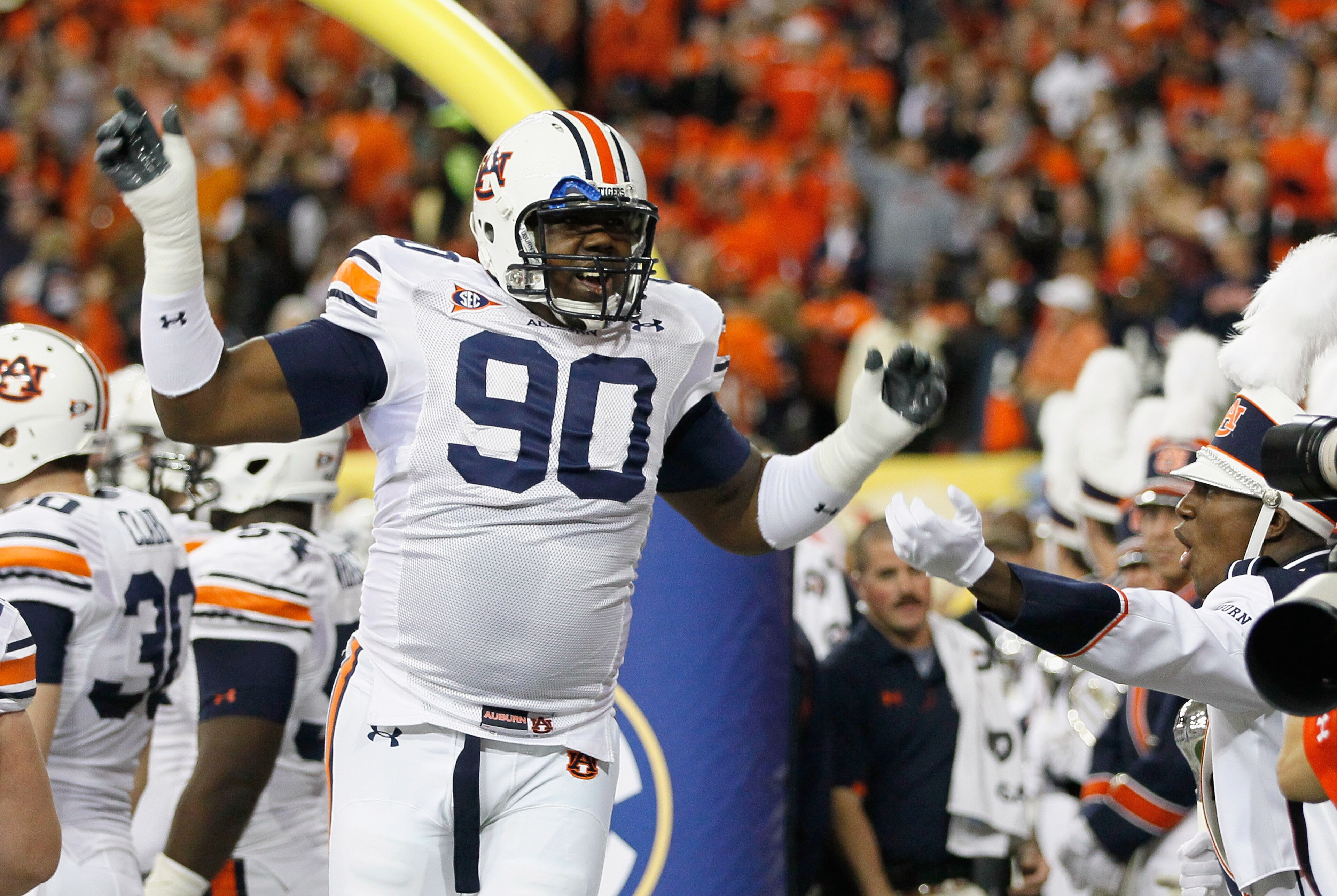 ATLANTA, GA - DECEMBER 04:  Nick Fairley #90 of the Auburn Tigers cheers during pregame warmups before facing the South Carolina Gamecocks during the 2010 SEC Championship at Georgia Dome on December 4, 2010 in Atlanta, Georgia.  (Photo by Kevin C. Cox/Ge