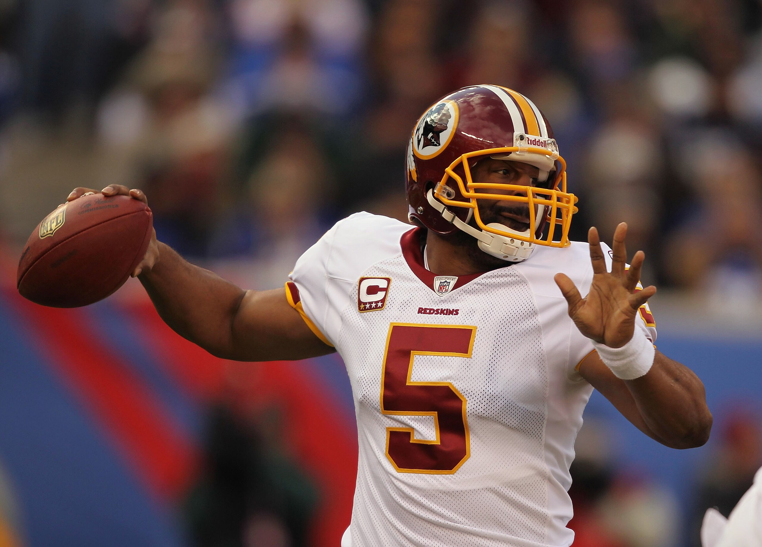 EAST RUTHERFORD, NJ - DECEMBER 05:  Donovan McNabb #5 of the Washington Redskins passes the  ball against the New York Giants  apply pressure during their game on December 5, 2010 at The New Meadowlands Stadium in East Rutherford, New Jersey.  (Photo by A