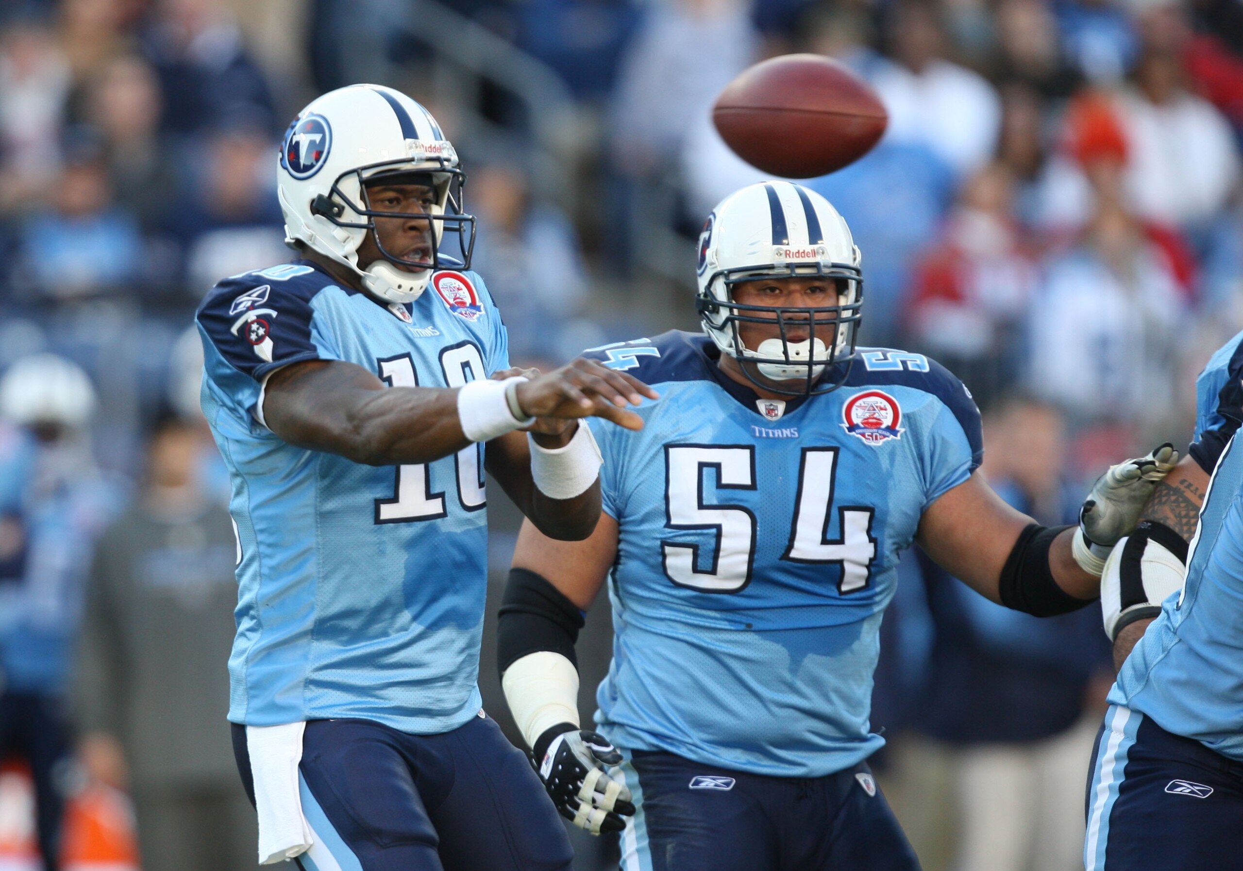 NASHVILLE, TN - NOVEMBER 1:  Vince Young #10 of the Tennessee Titans passes as Eugene Amano #54 looks on during the game against the Jacksonville Jaguars at LP Field on November 1, 2009 in Nashville, Tennessee. (Photo by Streeter Lecka/Getty Images)