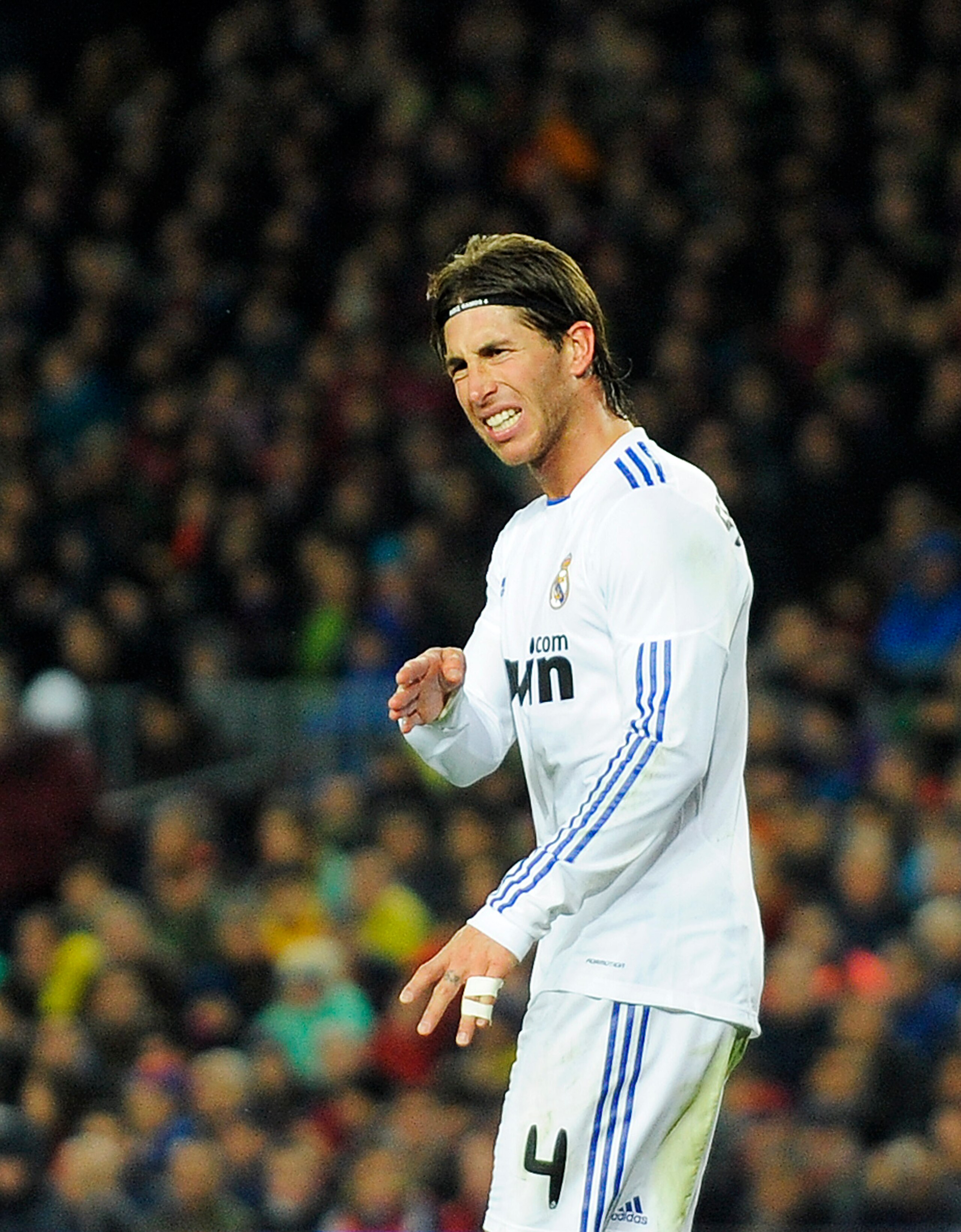 BARCELONA, SPAIN - NOVEMBER 29:  Sergio Ramos of Real Madrid reacts during the La Liga match between Barcelona and Real Madrid at the Camp Nou Stadium on November 29, 2010 in Barcelona, Spain. Barcelona won the match 5-0.  (Photo by David Ramos/Getty Imag