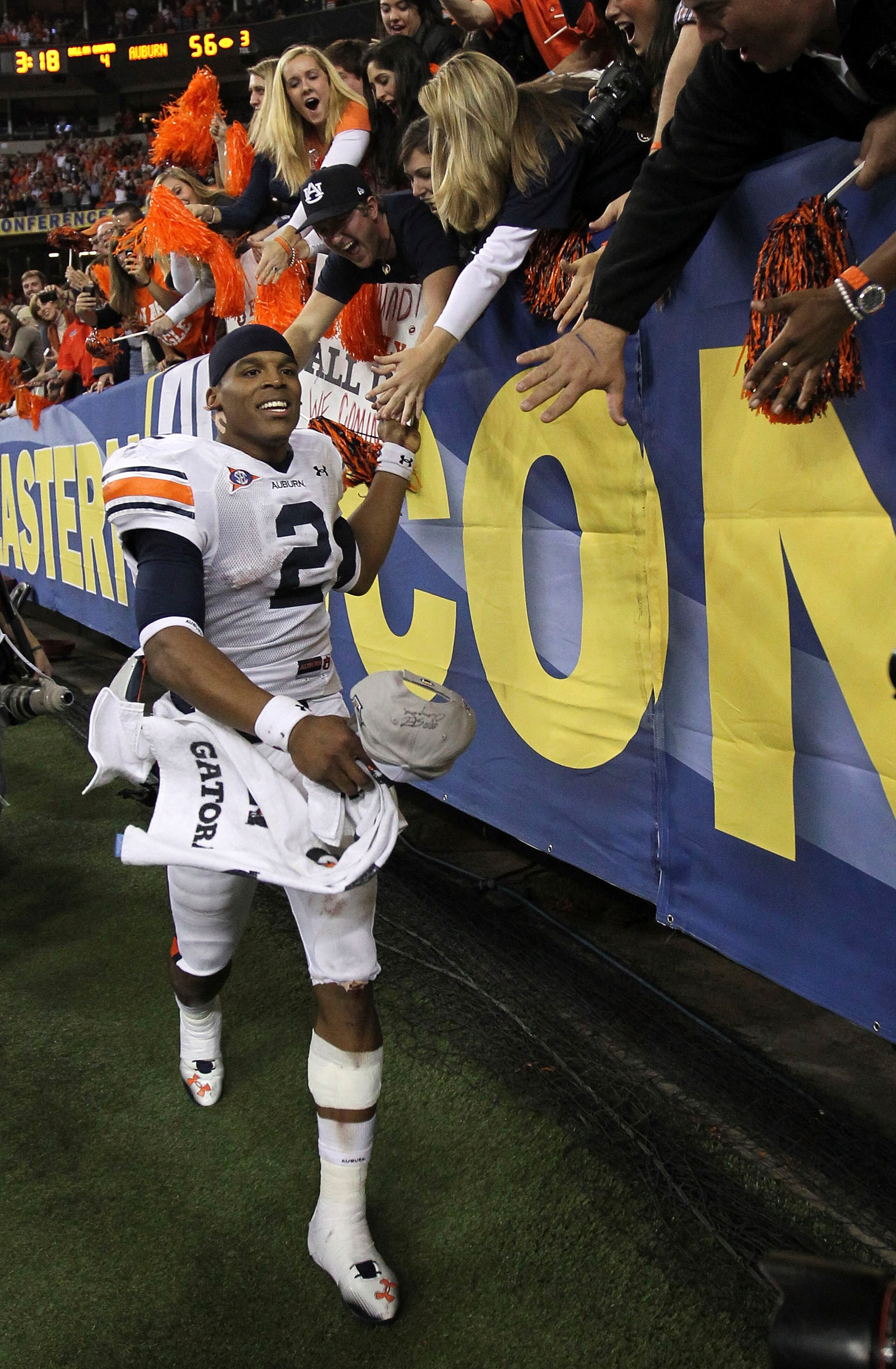 ATLANTA - DECEMBER 04:  Quarterback Cam Newton #2 of the Auburn Tigers celebrates with the crowd after the 2010 SEC Championship against the South Carolina Gamecocks at Georgia Dome on December 4, 2010 in Atlanta, Georgia.  The Tigers beat the Gamecocks 5