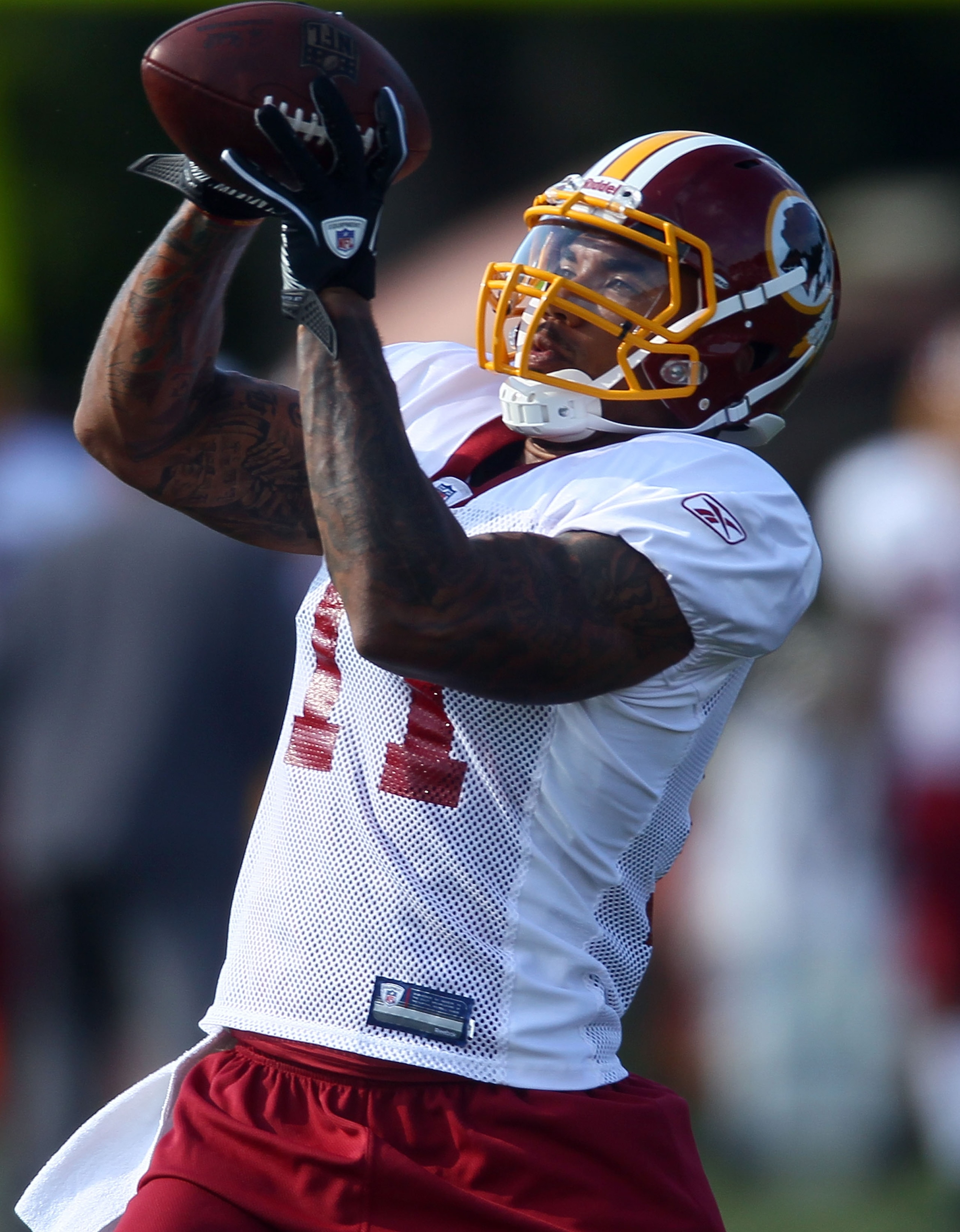 ASHBURN, VA - JULY 30:  Wide receiver Devin Thomas #11 of the Washington Redskins catches a pass during drills on the second day of training camp July 30, 2010 in Ashburn, Virginia.  (Photo by Win McNamee/Getty Images)