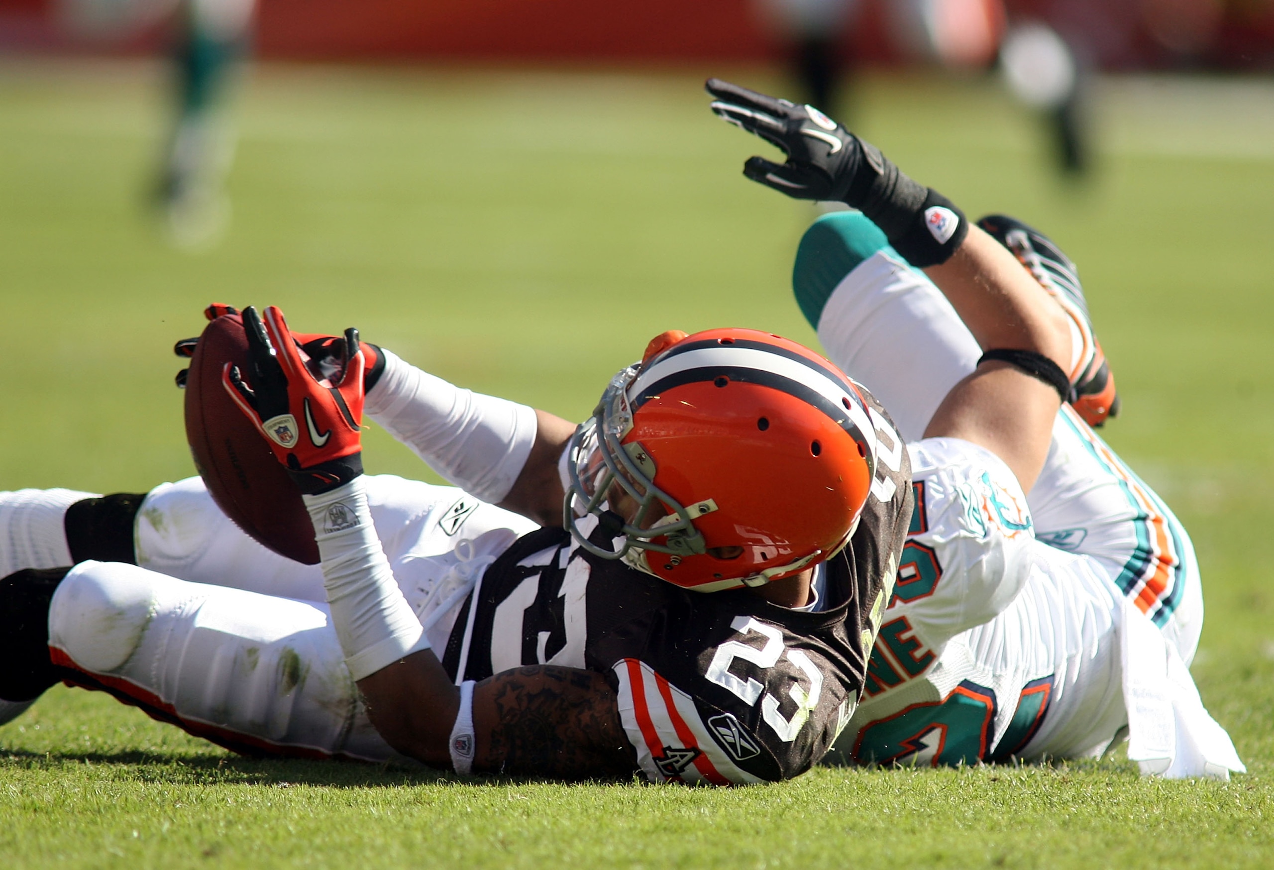 MIAMI - DECEMBER 05:  Defensive back Joe Haden #23 of the Cleveland Browns intercepts the ball against the Miami Dolphins at Sun Life Stadium on December 5, 2010 in Miami, Florida.  (Photo by Marc Serota/Getty Images)