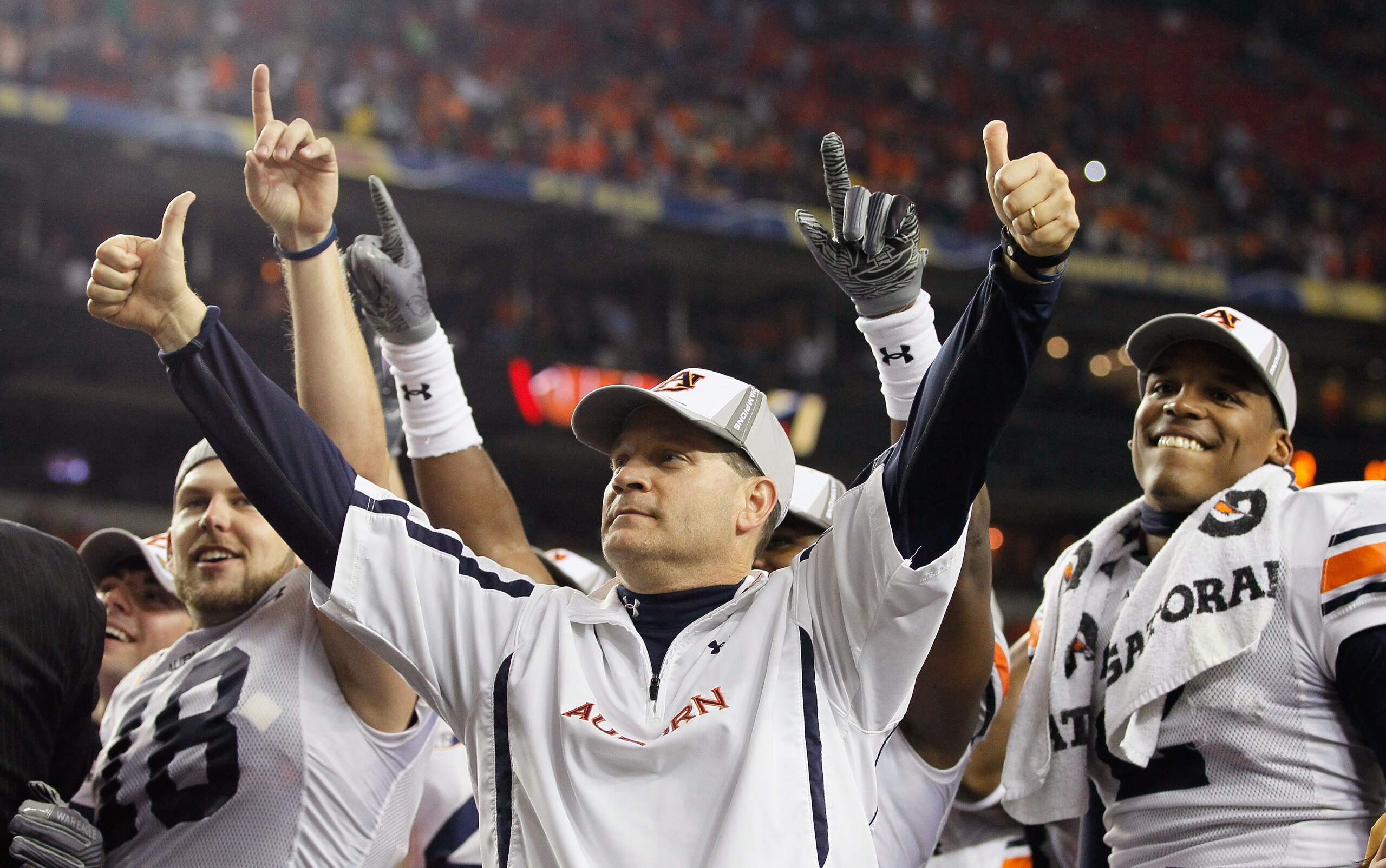 ATLANTA, GA - DECEMBER 04: Head coach Gene Chizik and quarterback Cam Newton #2 of the Auburn Tigers celebrate after their 56-17 win over the South Carolina Gamecocks during the 2010 SEC Championship at Georgia Dome on December 4, 2010 in Atlanta, Georgi ATLANTA, GA - DECEMBER 04: Head coach Gene Chizik and quarterback Cam Newton #2 of the Auburn Tigers celebrate after their 56-17 win over the South Carolina Gamecocks during the 2010 SEC Championship at Georgia Dome on December 4, 2010 in Atlanta, Georgi