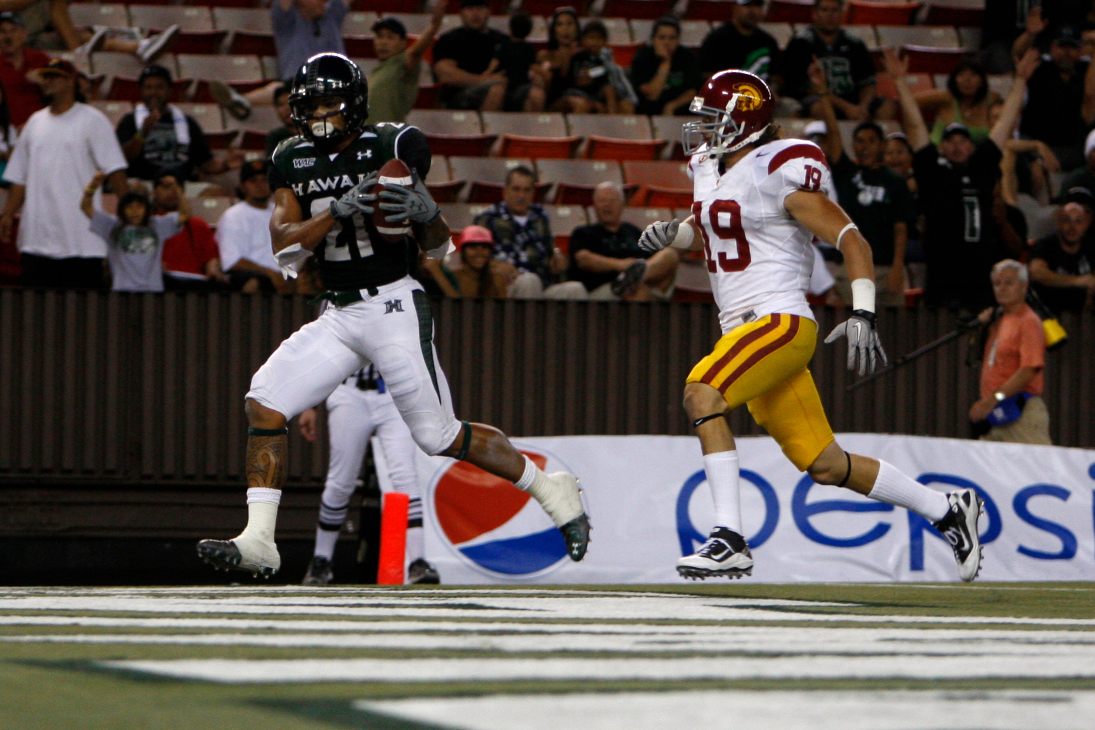 HONOLULU - SEPTEMBER 2: Kealoha Pilares of the University of Hawaii Warriors scores a touchdown during secondhalf action at Aloha Stadium September 2, 2010 in Honolulu, Hawaii. (Photo by Kent Nishimura/Getty Images) HONOLULU - SEPTEMBER 2: Kealoha Pilares of the University of Hawaii Warriors scores a touchdown during secondhalf action at Aloha Stadium September 2, 2010 in Honolulu, Hawaii. (Photo by Kent Nishimura/Getty Images)