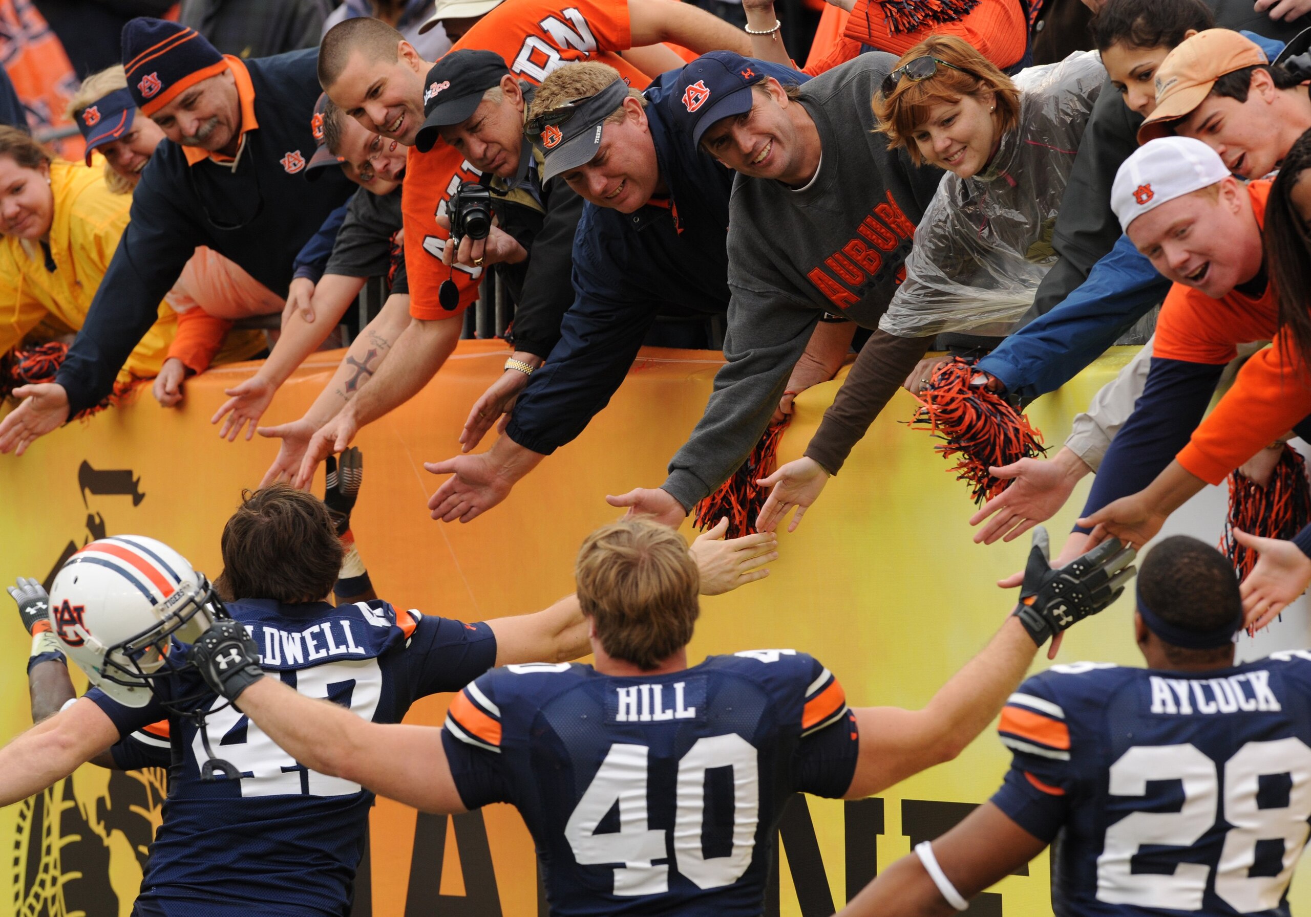 TAMPA, FL - JANUARY 1: Fans of the Auburn Tigers applaud a victory against the Northwestern Wildcats in the Outback Bowl January 1, 2010 at Raymond James Stadium in Tampa, Florida. (Photo by Al Messerschmidt/Getty Images) TAMPA, FL - JANUARY 1: Fans of the Auburn Tigers applaud a victory against the Northwestern Wildcats in the Outback Bowl January 1, 2010 at Raymond James Stadium in Tampa, Florida. (Photo by Al Messerschmidt/Getty Images)
