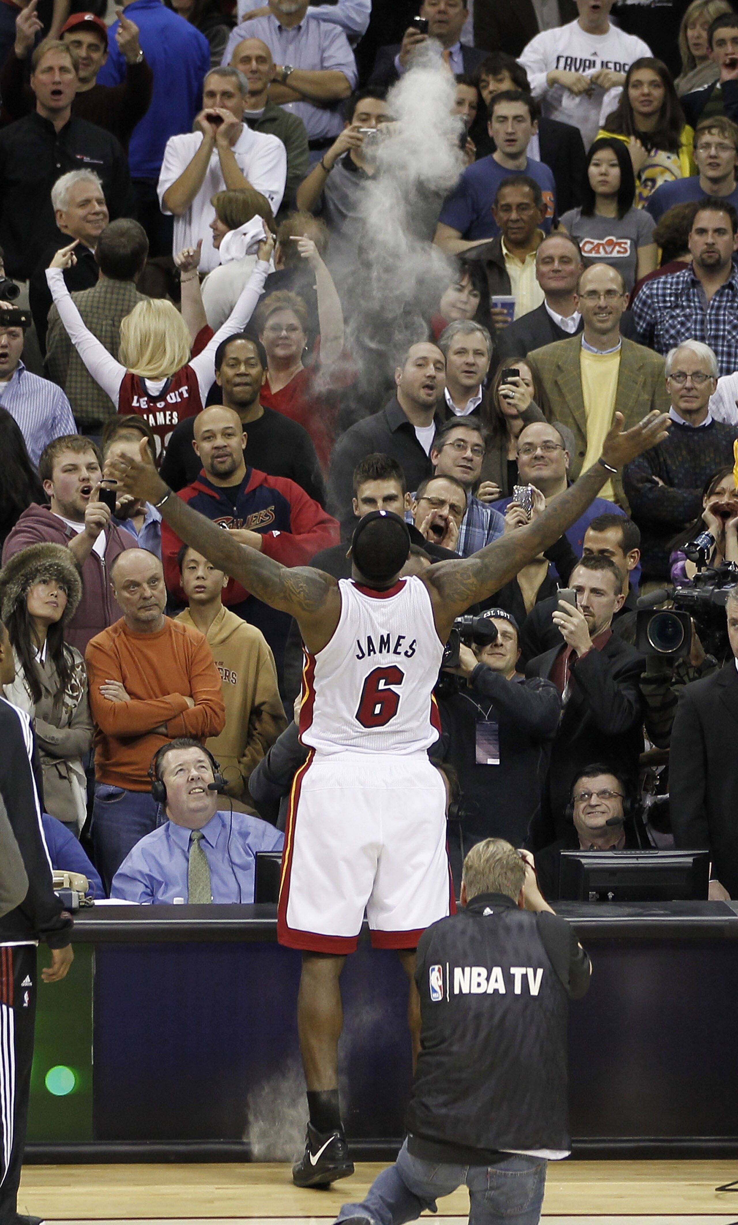 CLEVELAND, OH - DECEMBER 02:  LeBron James #6 of the Miami Heat throws powder in the air prior to playing the Cleveland Cavaliers at Quicken Loans Arena on December 2, 2010 in Cleveland, Ohio. NOTE TO USER: User expressly acknowledges and agrees that, by
