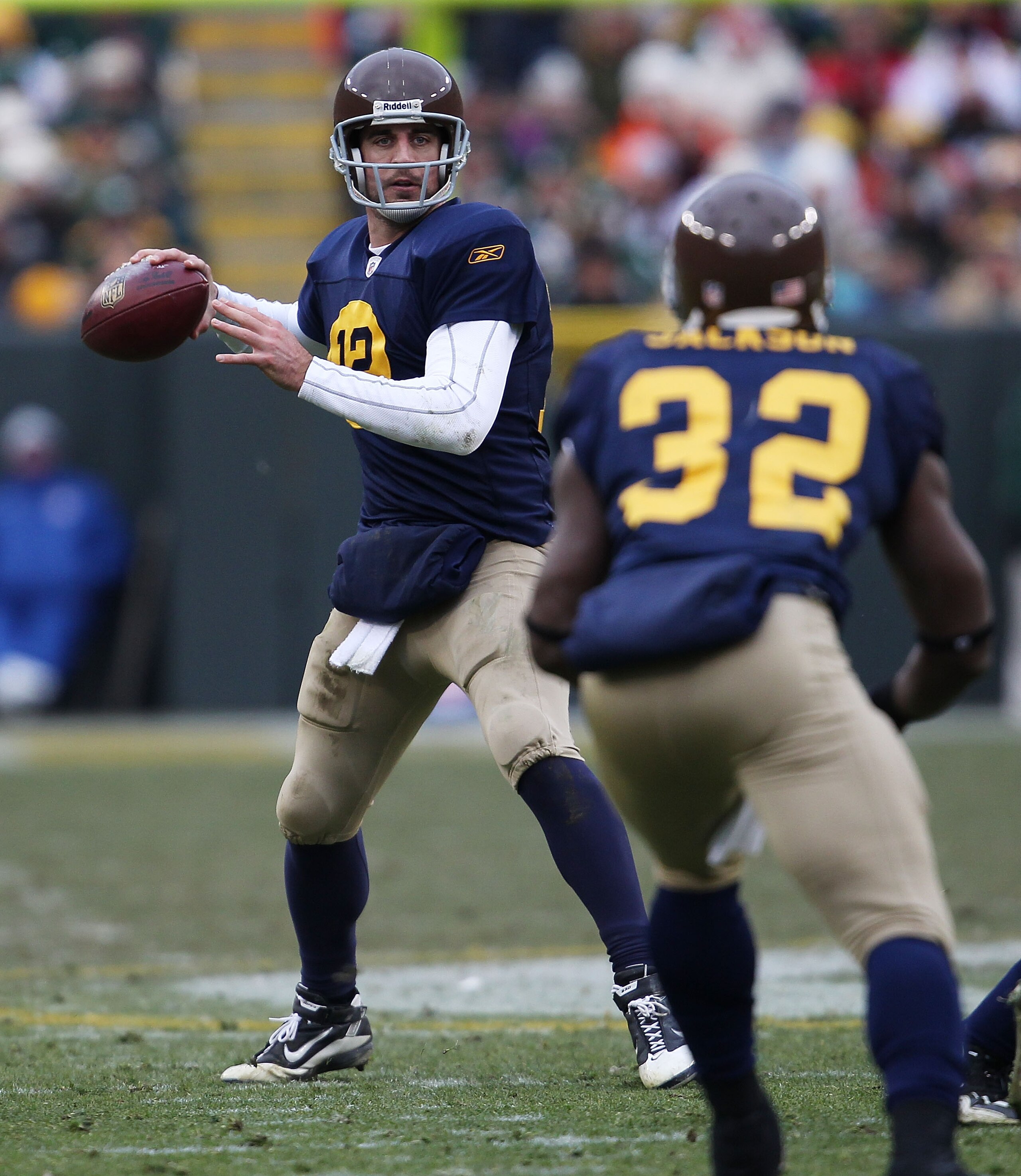 GREEN BAY, WI - DECEMBER 05: Aaron Rodgers #12 of the Green Bay Packers throws a pass to teammate Brandon Jakcson #32 against the San Francisco 49ers at Lambeau Field on December 5, 2010 in Green Bay, Wisconsin. The Packers defeated the 49ers 34-16. (Phot