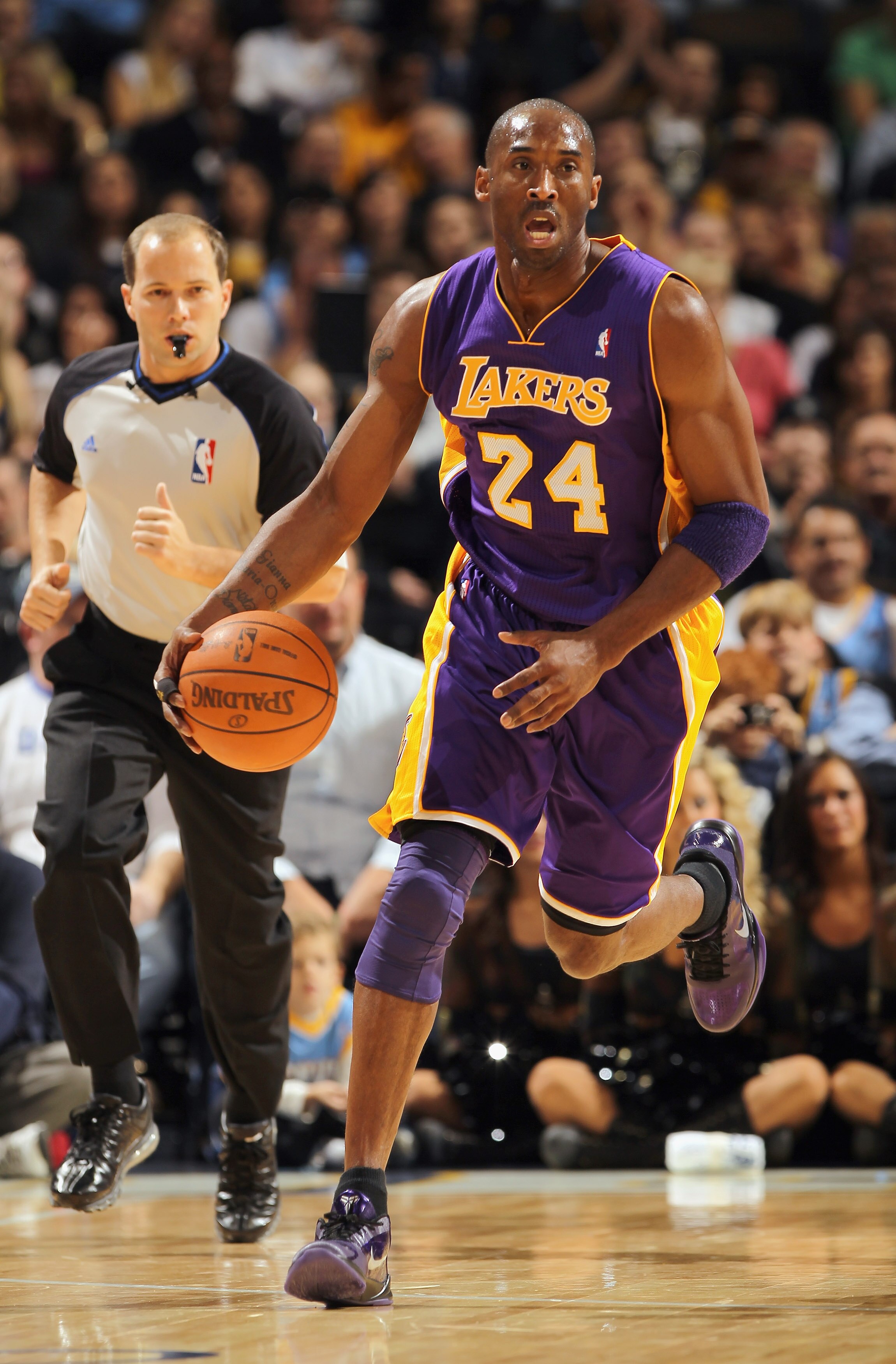 DENVER - NOVEMBER 11:  Kobe Bryant #24 of the Los Angeles Lakers dribbles the ball upcourt against the Denver Nuggets at the Pepsi Center on November 11, 2010 in Denver, Colorado. The Nuggets defeated the Lakers 118-112.  NOTE TO USER: User expressly ackn