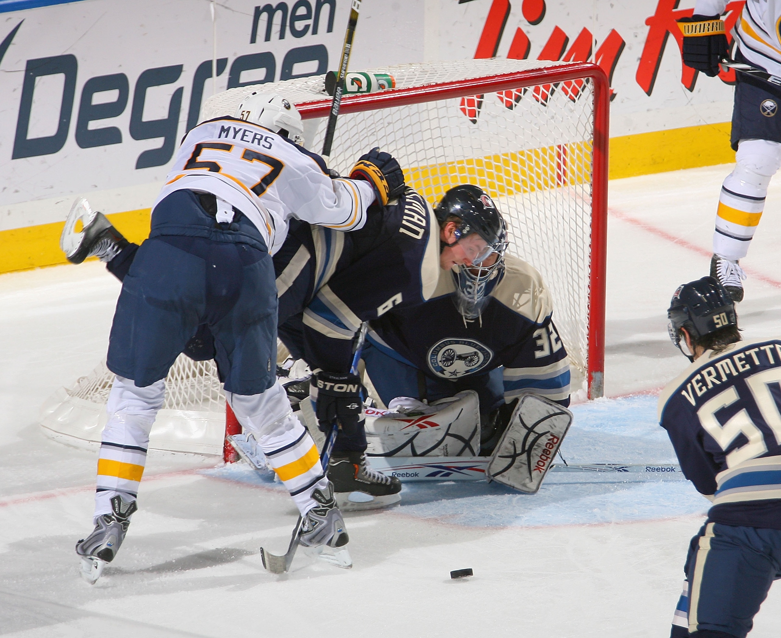 BUFFALO, NY - DECEMBER 03: Anton Stralman #6 and Mathieu Garon #32  of the Columbus Blue Jackets defend against Tyler Myers #57 of the Buffalo Sabres  at HSBC Arena  on December 3, 2010 in Buffalo, New York.  (Photo by Rick Stewart/Getty Images)