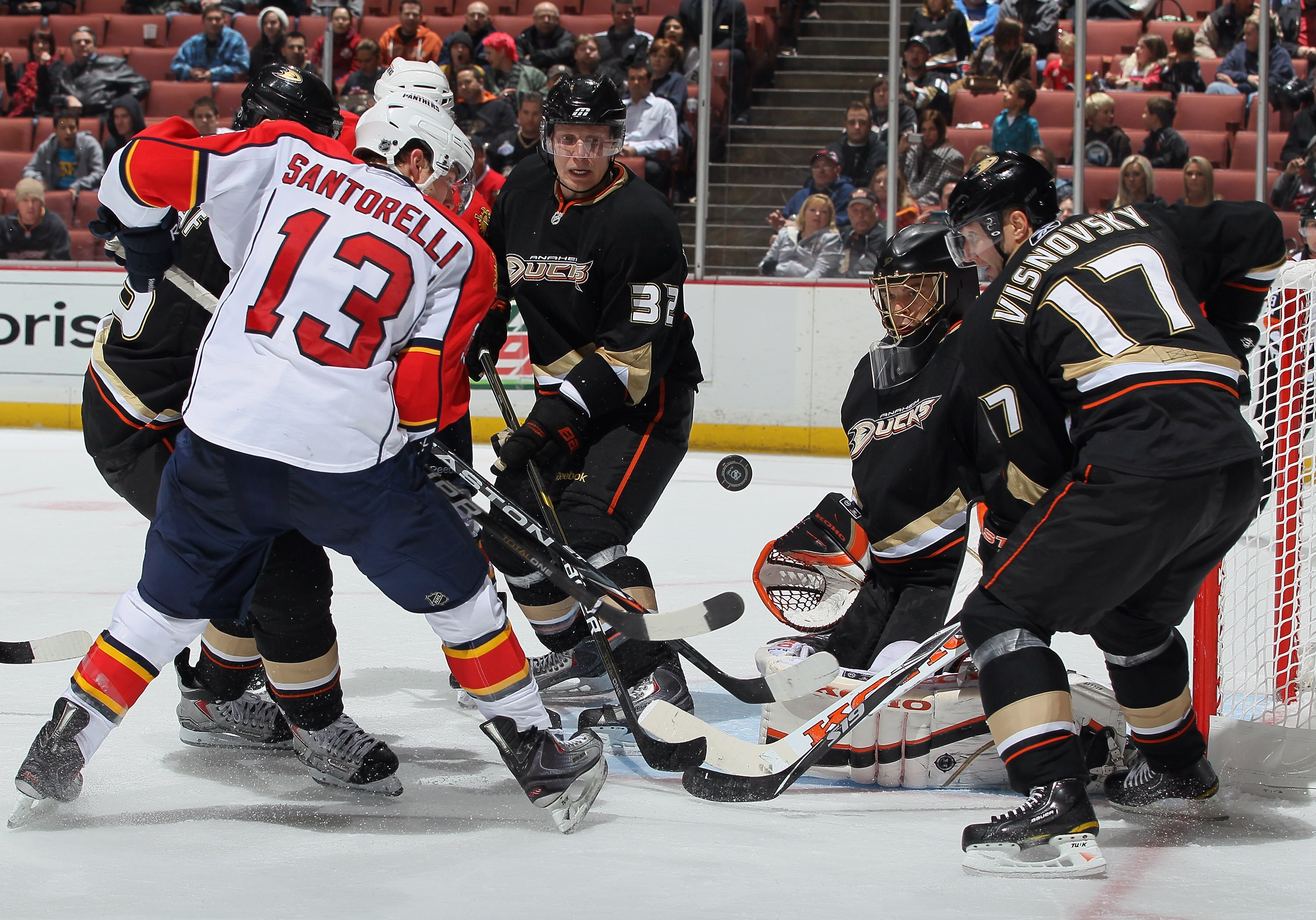ANAHEIM, CA - DECEMBER 01:  (L-R) Mike Santorelli #13 of the Florida Panthers shoots the puck, as Toni Lydman #32, goaltender Jonas Hiller #1 and Lubomir Visnovsky #17 of the Anaheim Ducks defend the net  during the third period at the Honda Center on Dec