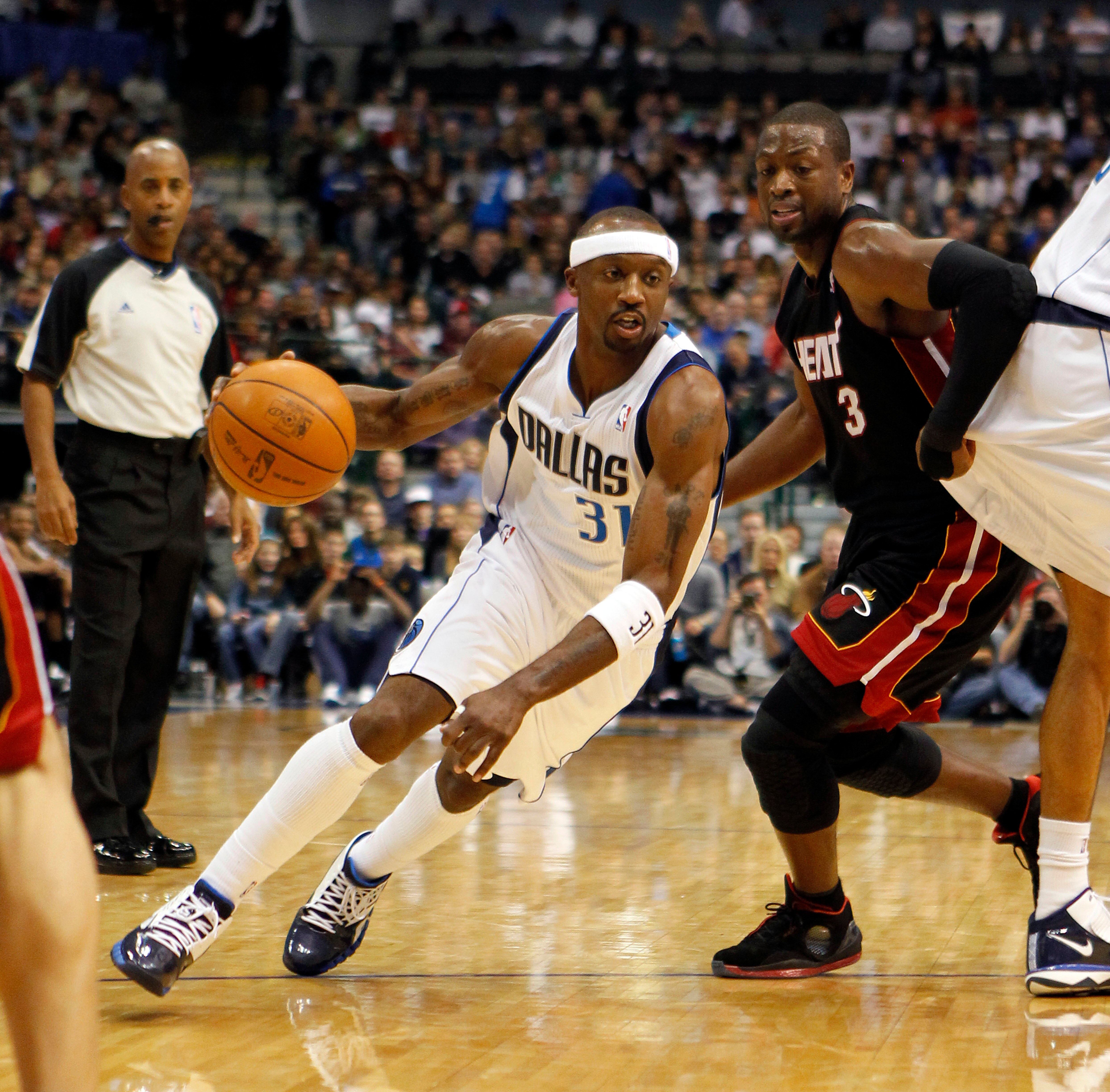 DALLAS - NOVEMBER 27: Jason Terry #31 of the Dallas Mavericks drives by Dwyane Wade #3 of the Miami Heat on November 27, 2010 at the American Airlines Center in Dallas, Texas. NOTE TO USER: User expressly acknowledges and agrees that, by downloading and o