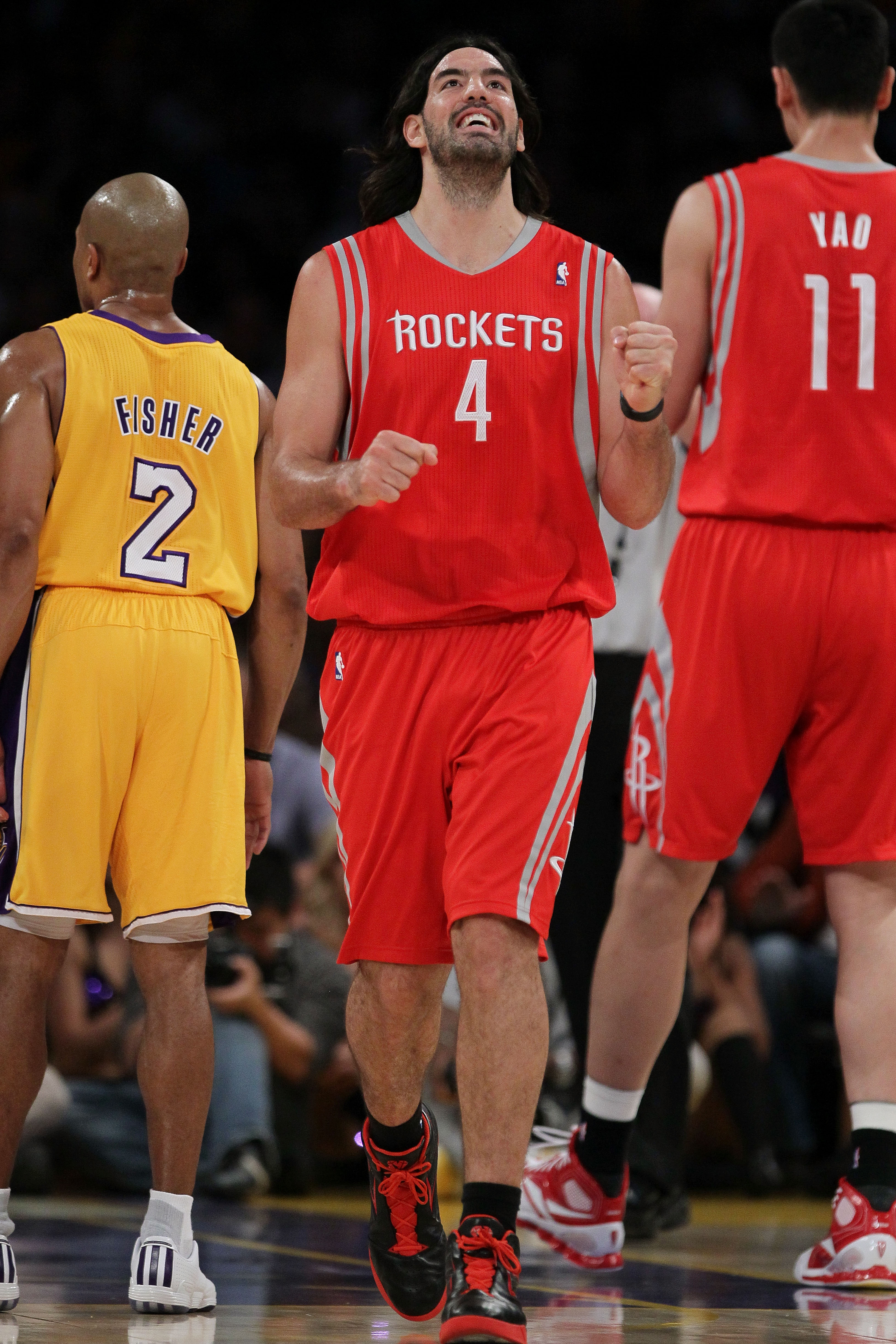LOS ANGELES, CA - OCTOBER 26:  Luis Scola #4 of the Houston Rockets reacts to a play against the Los Angeles Lakers during their opening night game at Staples Center on October 26, 2010 in Los Angeles, California. NOTE TO USER: User expressly acknowledges