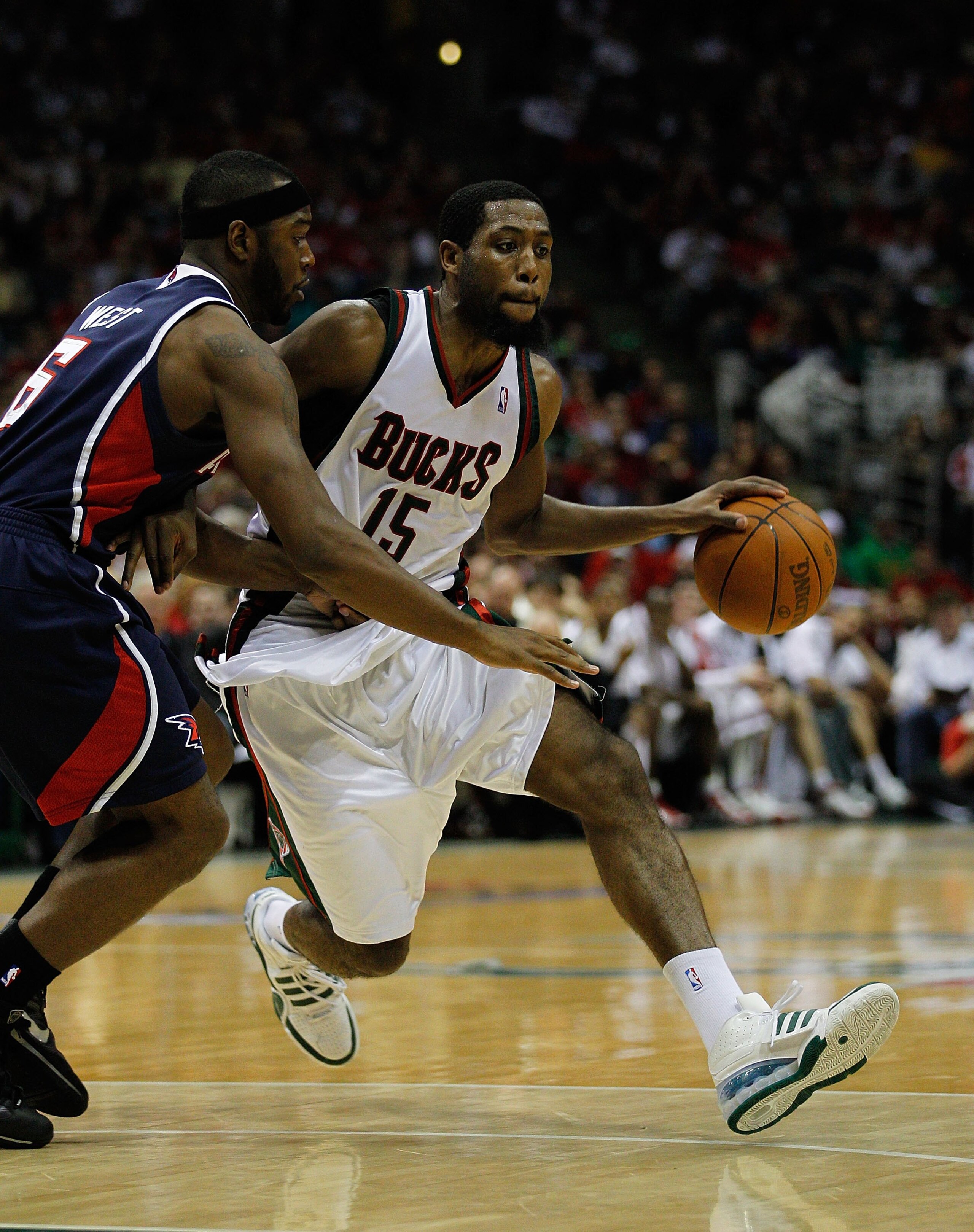 MILWAUKEE - APRIL 30: John Salmons #15 of the Milwaukee Bucks drives around Mario West #6 of the Atlanta Hawks in Game Six of the Eastern Conference Quarterfinals during the 2010 NBA Playoffs at the Bradley Center on April 30, 2010 in Milwaukee, Wisconsin