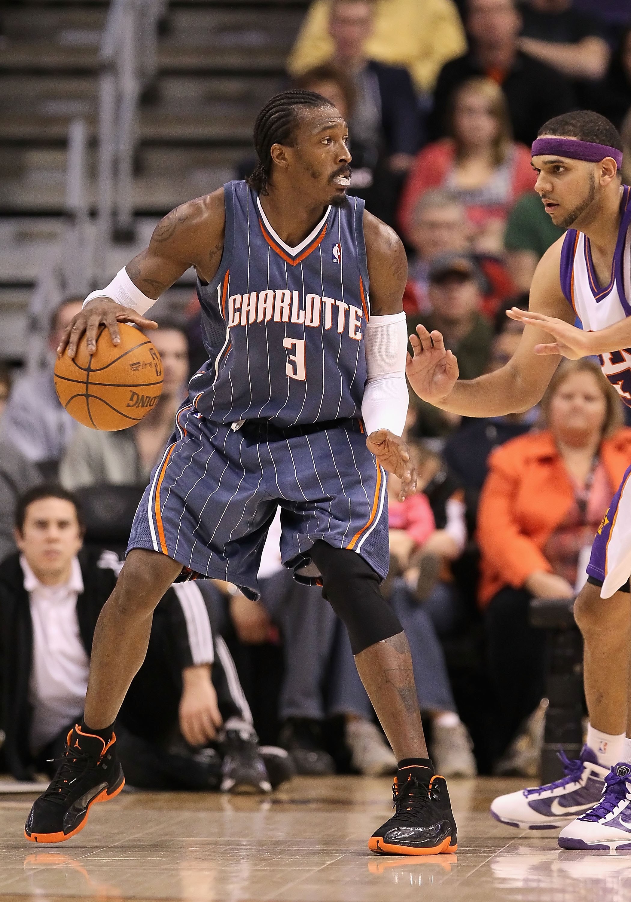 PHOENIX - JANUARY 26:  Gerald Wallace #3 of the Charlotte Bobcats handles the ball during the NBA game against the Phoenix Suns at US Airways Center on January 26, 2010 in Phoenix, Arizona. The Bobcats defeated the Suns in overtime.  114-109.  NOTE TO USE