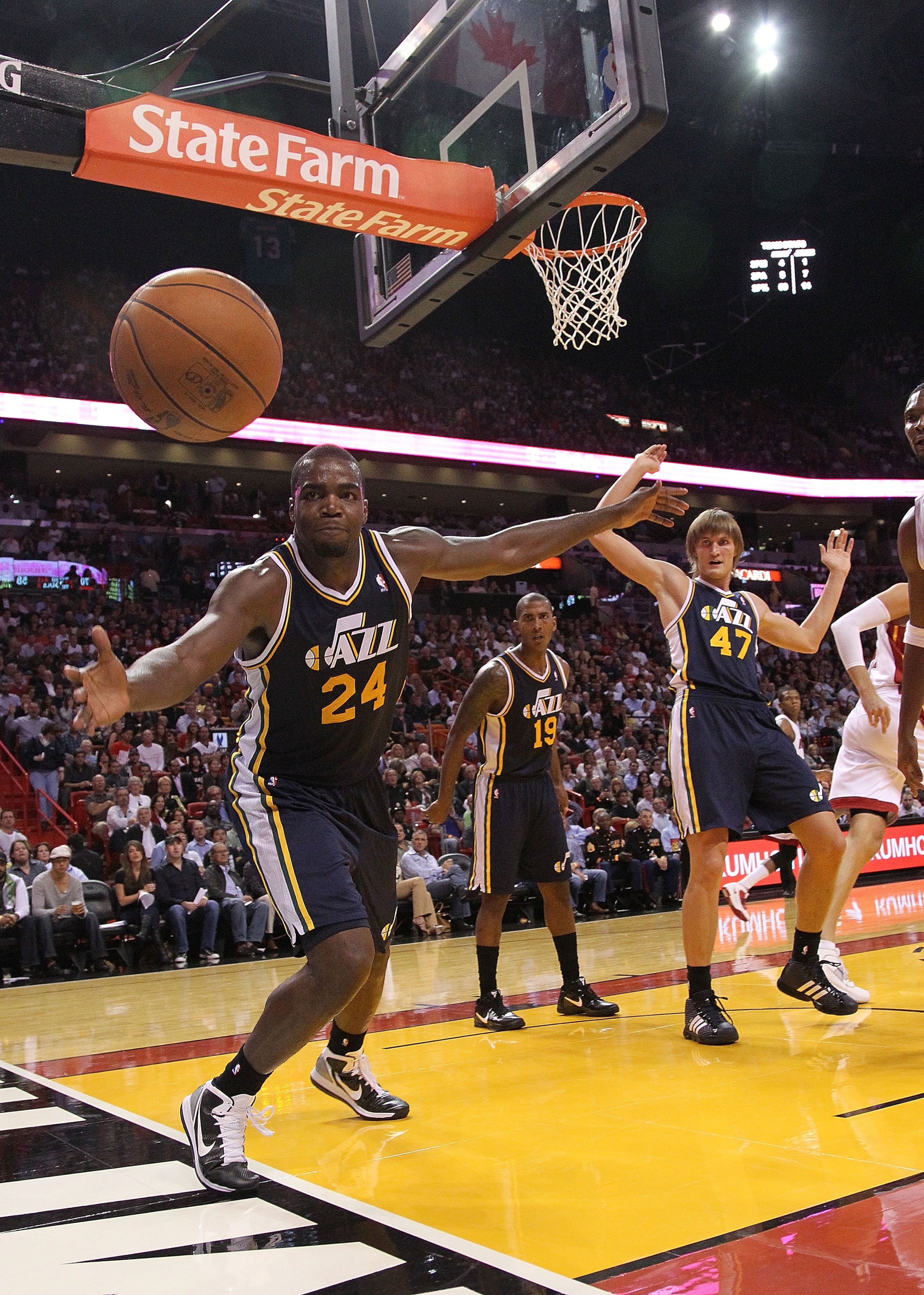 MIAMI - NOVEMBER 09:  Paul Millsap #24 of the Utah Jazz tries to stop a ball from going out of bounds during a game against the Miami Heat at American Airlines Arena on November 9, 2010 in Miami, Florida. NOTE TO USER: User expressly acknowledges and agre