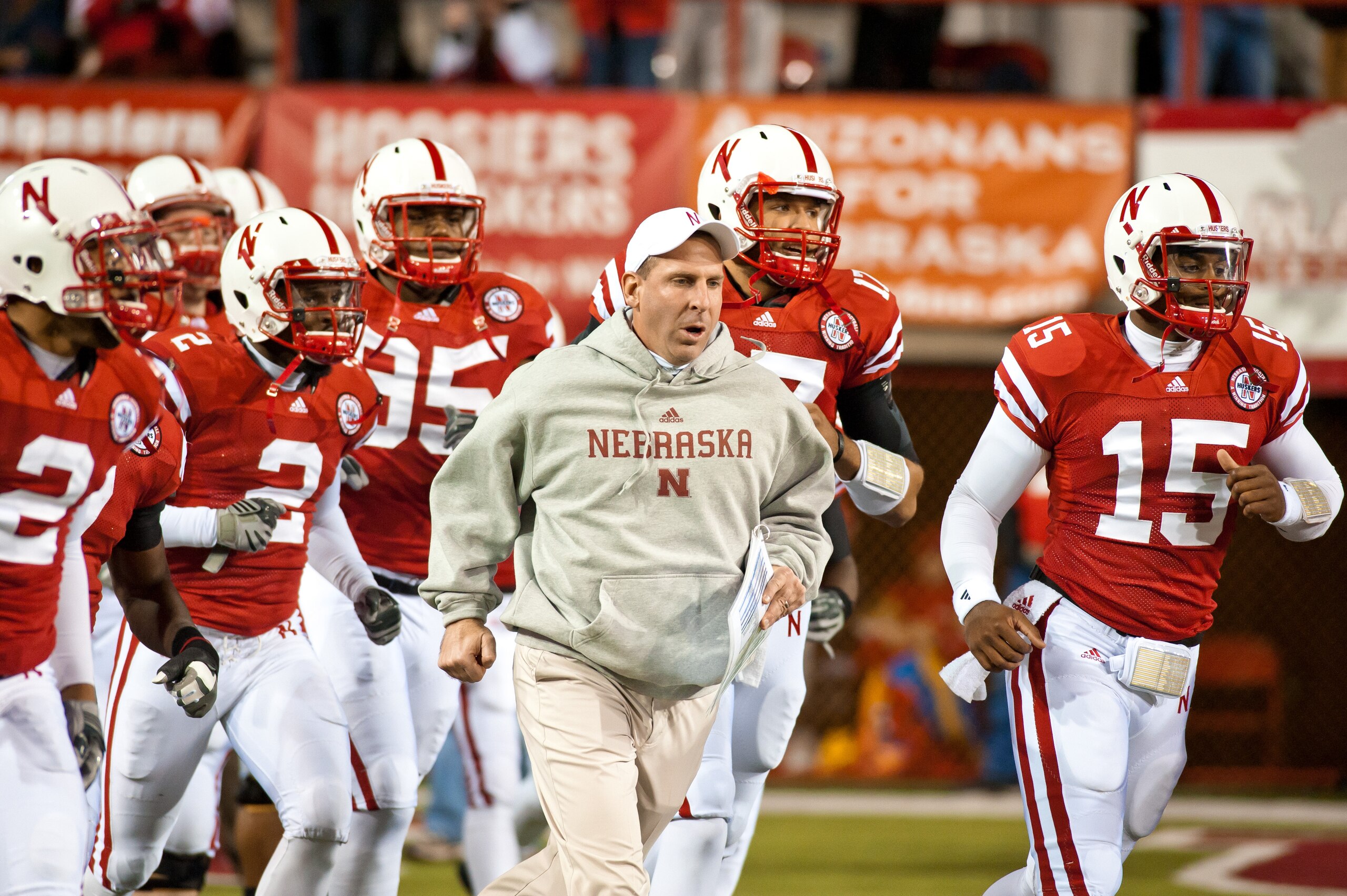LINCOLN, NE - NOVEMBER 13: Coach Bo Pelini of the Nebraska Cornhuskers leads his team onto the field to play the Kansas Jayhawks at Memorial Stadium on November 13, 2010 in Lincoln, Nebraska. Nebraska Defeated Kansas 20-3. (Photo by Eric Francis/Getty Ima LINCOLN, NE - NOVEMBER 13: Coach Bo Pelini of the Nebraska Cornhuskers leads his team onto the field to play the Kansas Jayhawks at Memorial Stadium on November 13, 2010 in Lincoln, Nebraska. Nebraska Defeated Kansas 20-3. (Photo by Eric Francis/Getty Ima
