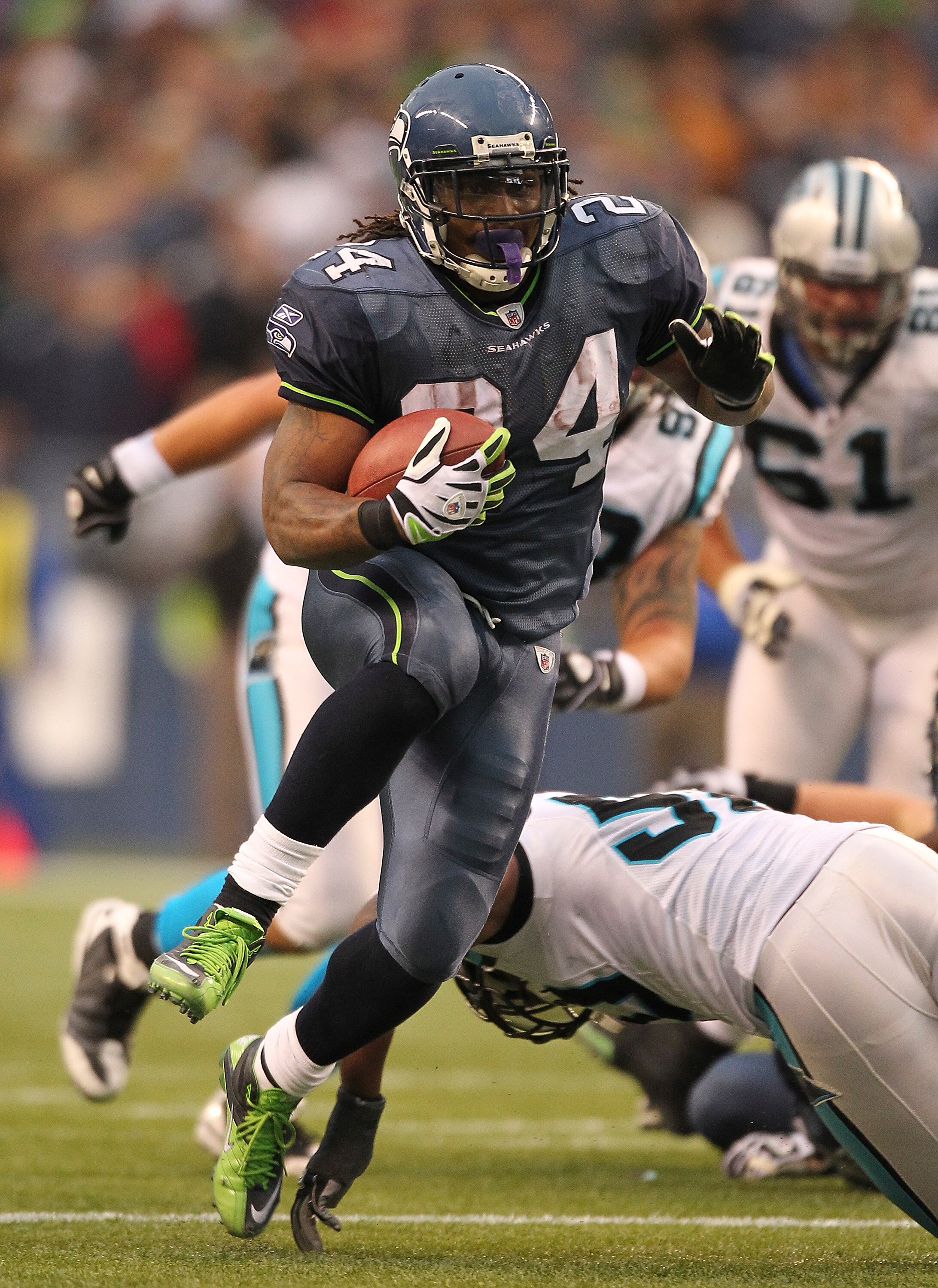 SEATTLE, WA - DECEMBER 05:  Running back Marshawn Lynch #24 of the Seattle Seahawks rushes for a touchdown in the fourth quarter against the Carolina Panthers at Qwest Field on December 5, 2010 in Seattle, Washington. The Seahawks defeated the Panthers 31