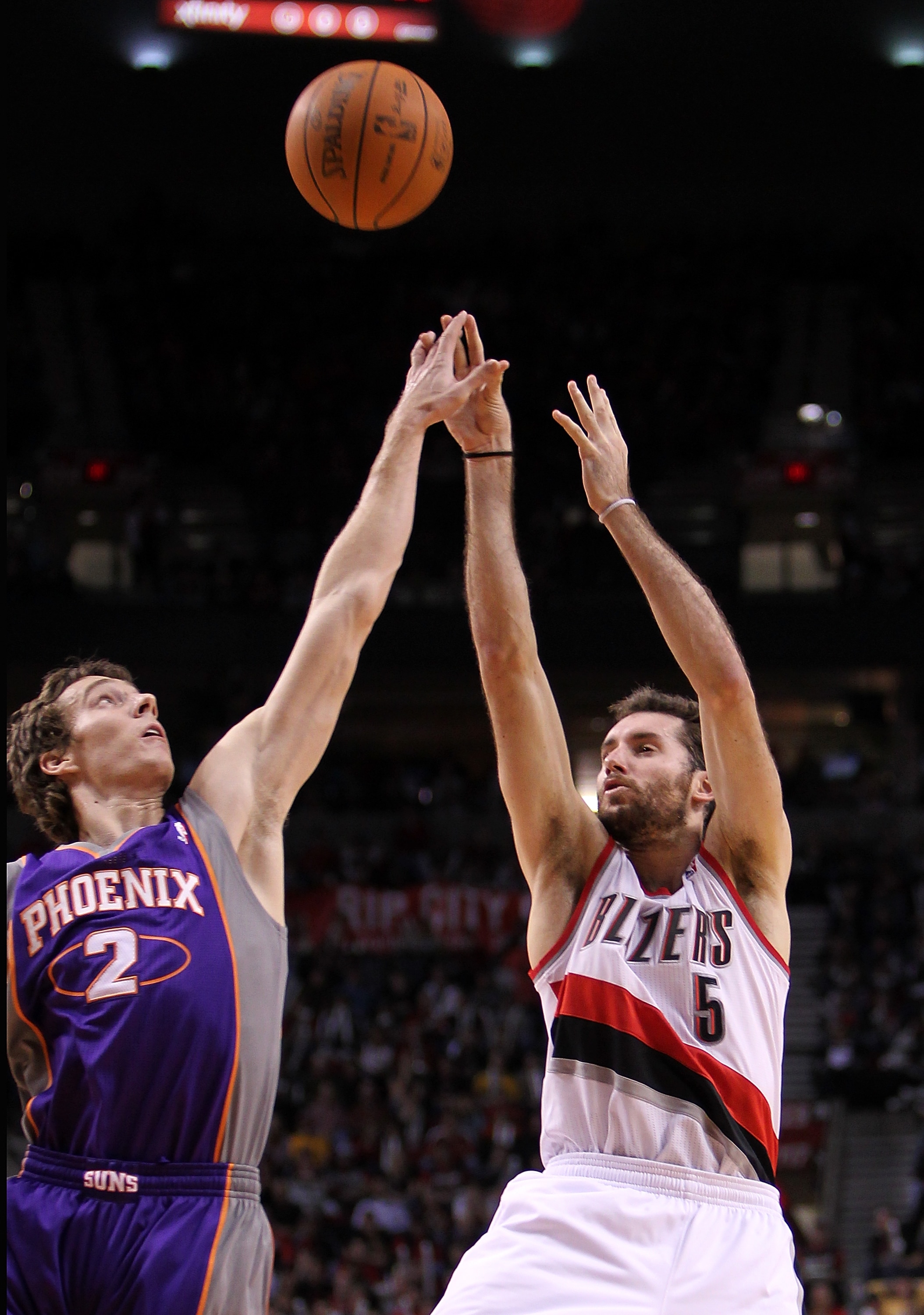 PORTLAND, OR - OCTOBER 26:  Rudy Fernandez #5 of the Portland Trail Blazers shoots the ball over Goran Dragic #2 of the Phoeninx Suns on October 26, 2010 at the Rose Garden in Portland, Oregon.  NOTE TO USER: User expressly acknowledges and agrees that, b