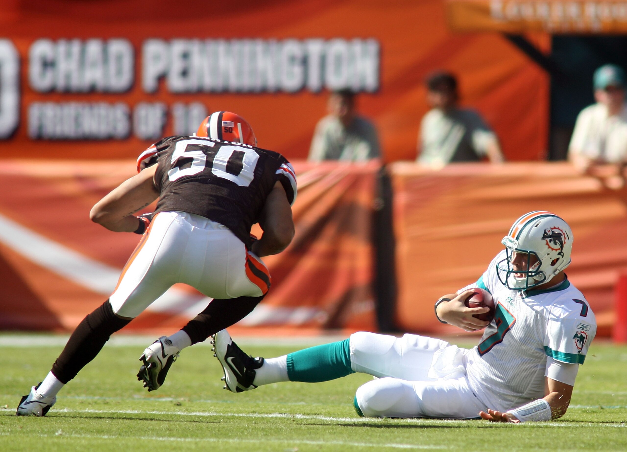 MIAMI - DECEMBER 05:  Quarterback Chad Henne #7 of the Miami Dolphins is hit late by Linebacker Eric Barton #50 of the Cleveland Browns while sliding at Sun Life Stadium on December 5, 2010 in Miami, Florida.  (Photo by Marc Serota/Getty Images)