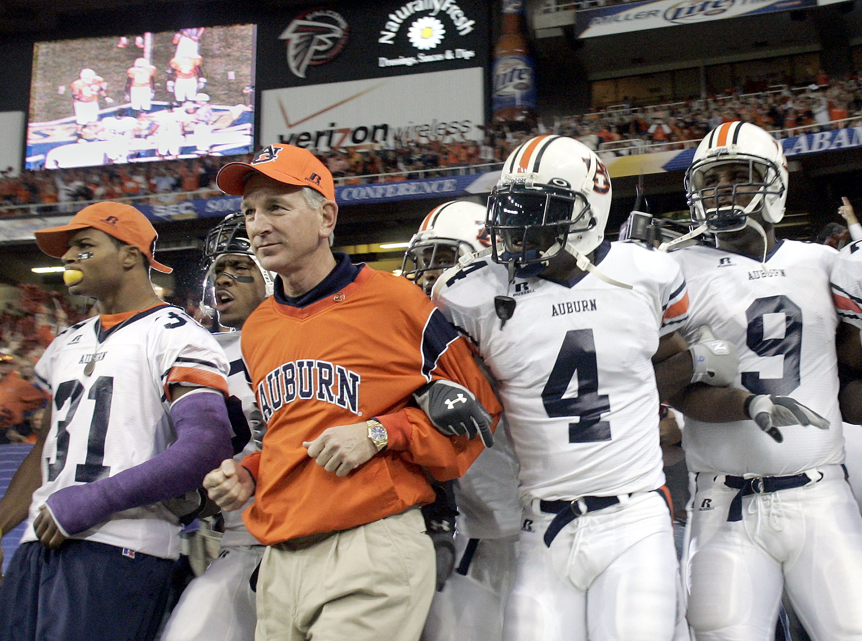 ATLANTA - DECEMBER 4:  Head coach Tommy Tuberville of the Auburn Tigers leads his team onto the field against the Tennessee Volunteers in the 2004 SEC Championship Game at the Georgia Dome on December 4, 2004 in Atlanta, Georgia. (Photo by Grant Halverson