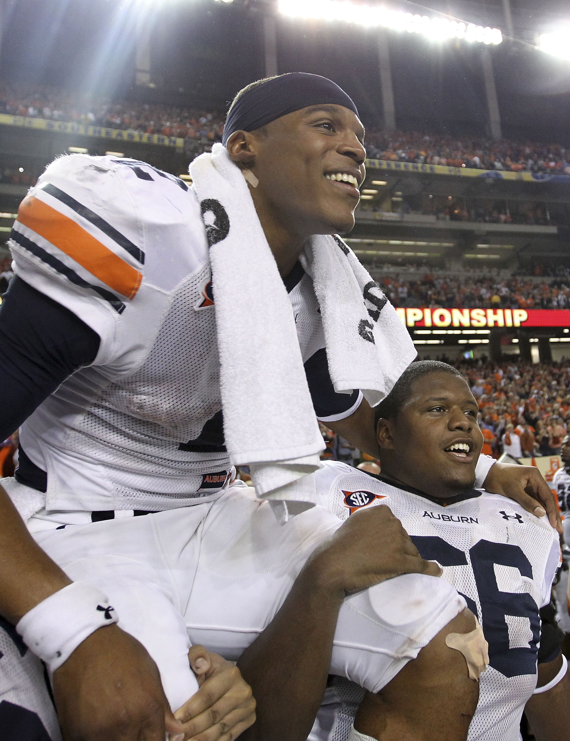 ATLANTA - DECEMBER 04:  Quarterback Cam Newton #2 of the Auburn Tigers is carried on the field after the 2010 SEC Championship against the South Carolina Gamecocks at Georgia Dome on December 4, 2010 in Atlanta, Georgia.  The Tigers beat the Gamecocks 56-