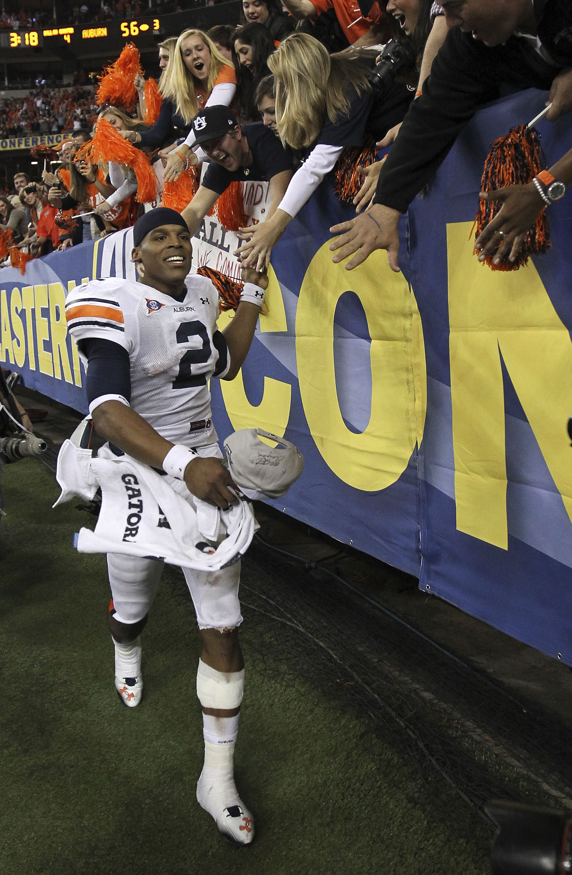 ATLANTA - DECEMBER 04:  Quarterback Cam Newton #2 of the Auburn Tigers celebrates with the crowd after the 2010 SEC Championship against the South Carolina Gamecocks at Georgia Dome on December 4, 2010 in Atlanta, Georgia.  The Tigers beat the Gamecocks 5