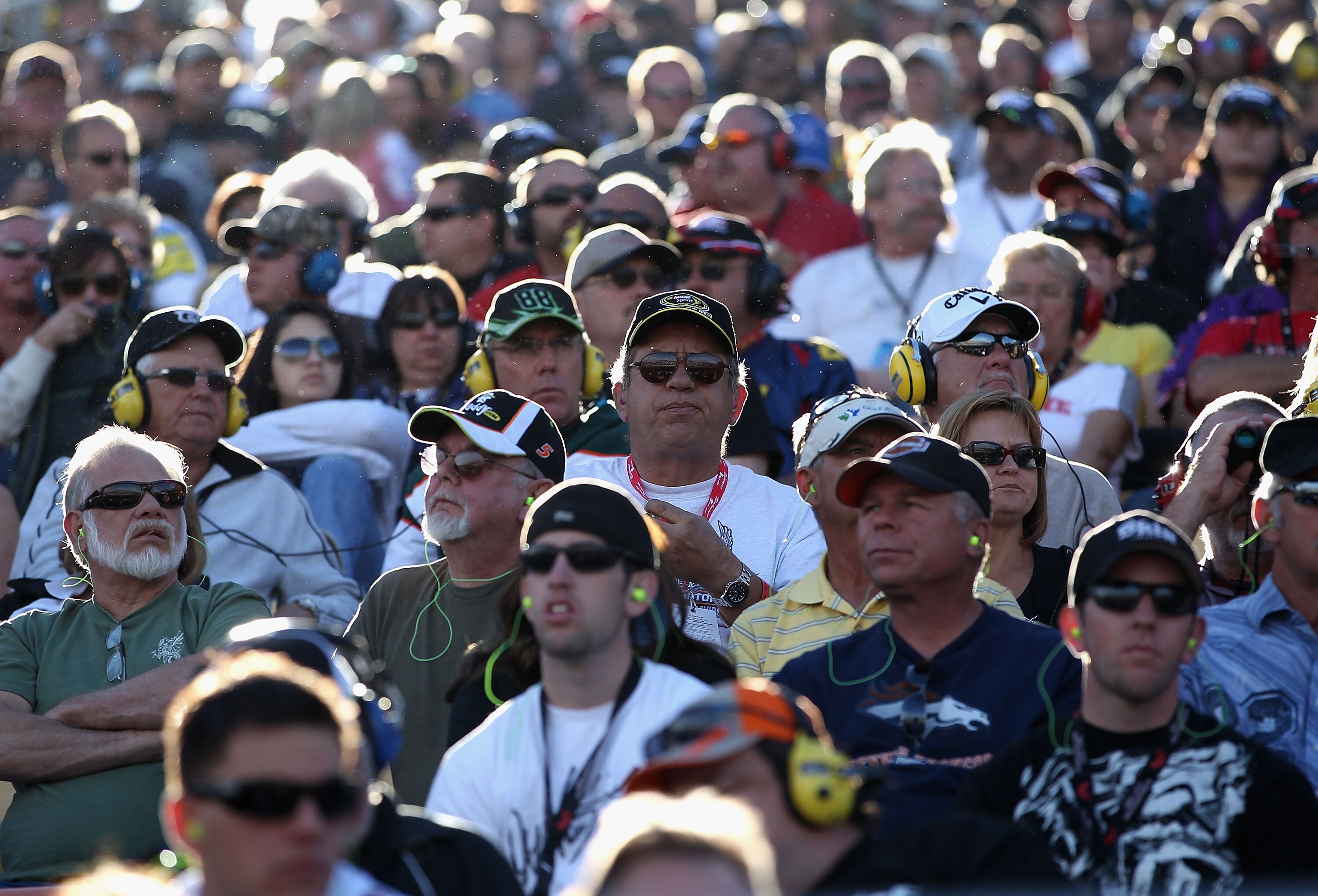 AVONDALE, AZ - NOVEMBER 14:  Fans watch race action during the NASCAR Sprint Cup Series Kobalt Tools 500 at Phoenix International Raceway on November 14, 2010 in Avondale, Arizona.  (Photo by Christian Petersen/Getty Images for NASCAR)