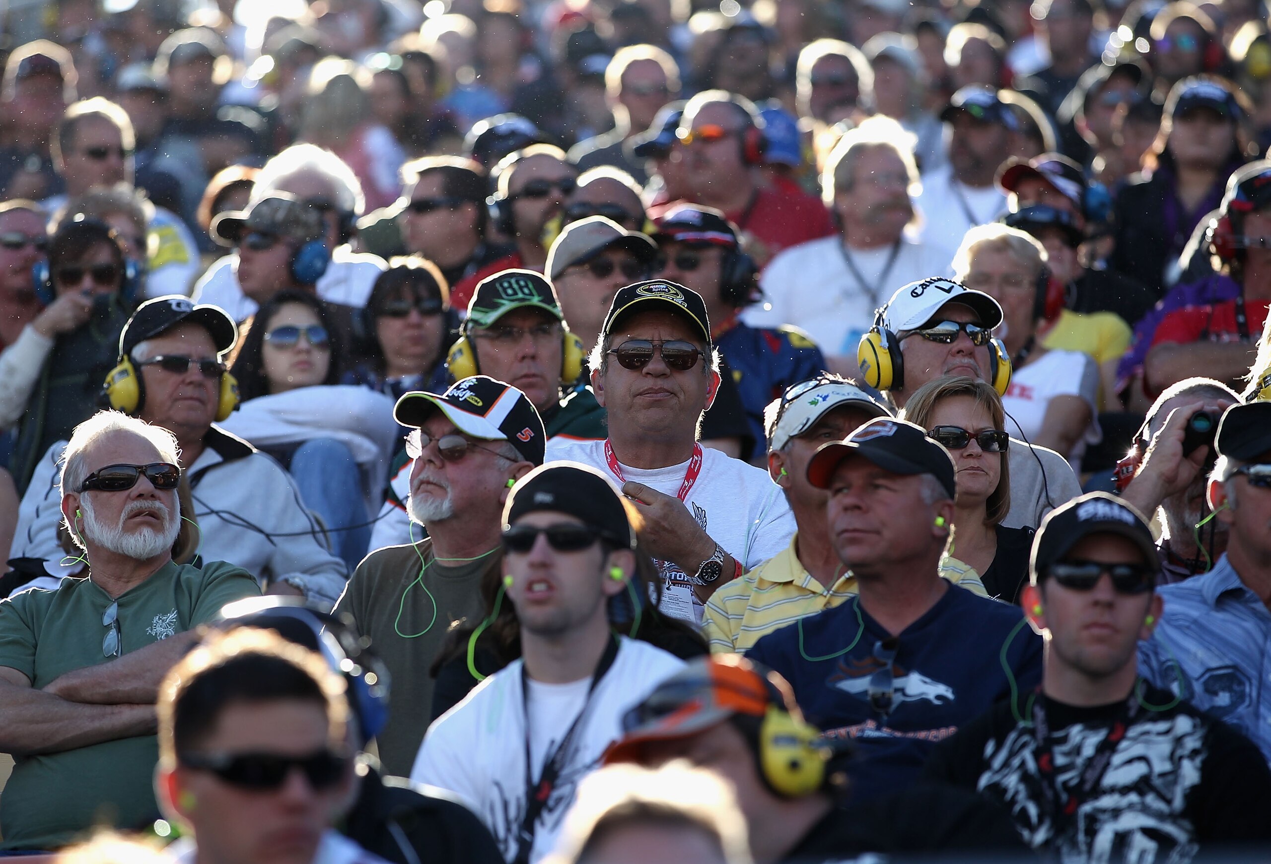 AVONDALE, AZ - NOVEMBER 14:  Fans watch race action during the NASCAR Sprint Cup Series Kobalt Tools 500 at Phoenix International Raceway on November 14, 2010 in Avondale, Arizona.  (Photo by Christian Petersen/Getty Images for NASCAR)
