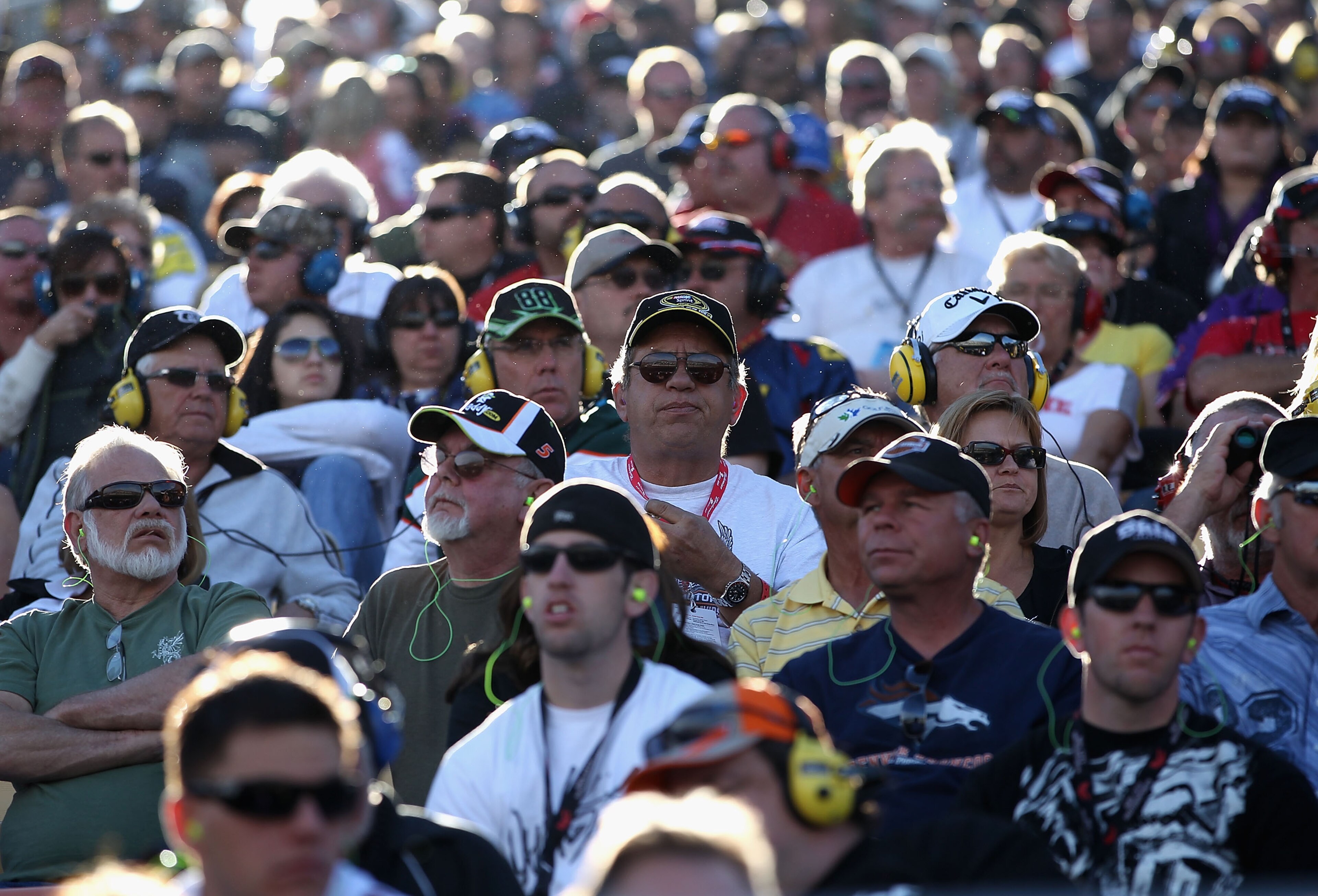 AVONDALE, AZ - NOVEMBER 14:  Fans watch race action during the NASCAR Sprint Cup Series Kobalt Tools 500 at Phoenix International Raceway on November 14, 2010 in Avondale, Arizona.  (Photo by Christian Petersen/Getty Images for NASCAR)