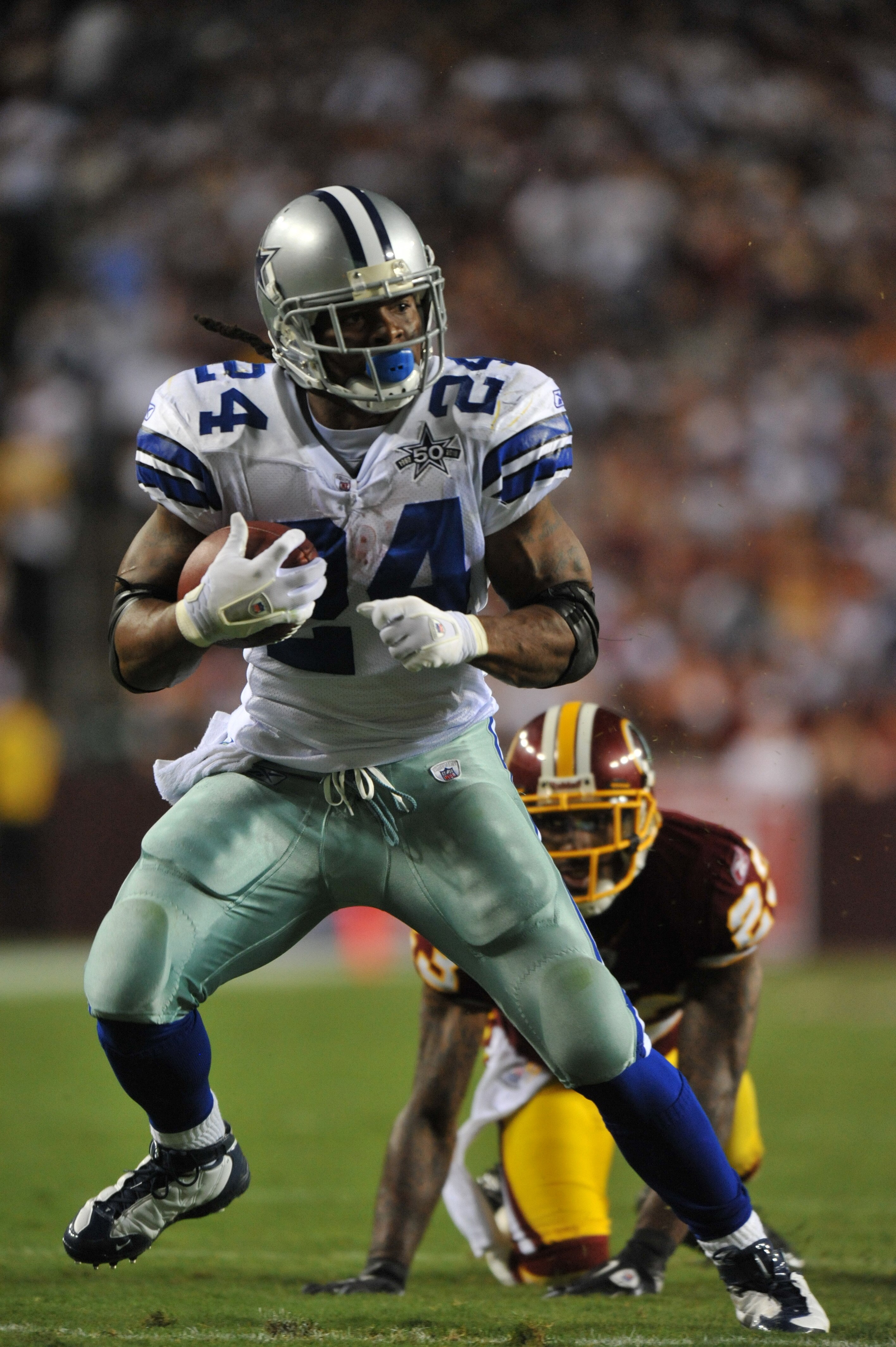 LANDOVER - SEPTEMBER 12:  Marion Barber #24 of the Dallas Cowboys runs the ball during the NFL season opener against the Washington Redskins at FedExField on September 12, 2010 in Landover, Maryland. The Redskins defeated the Cowboys 13-7. (Photo by Larry