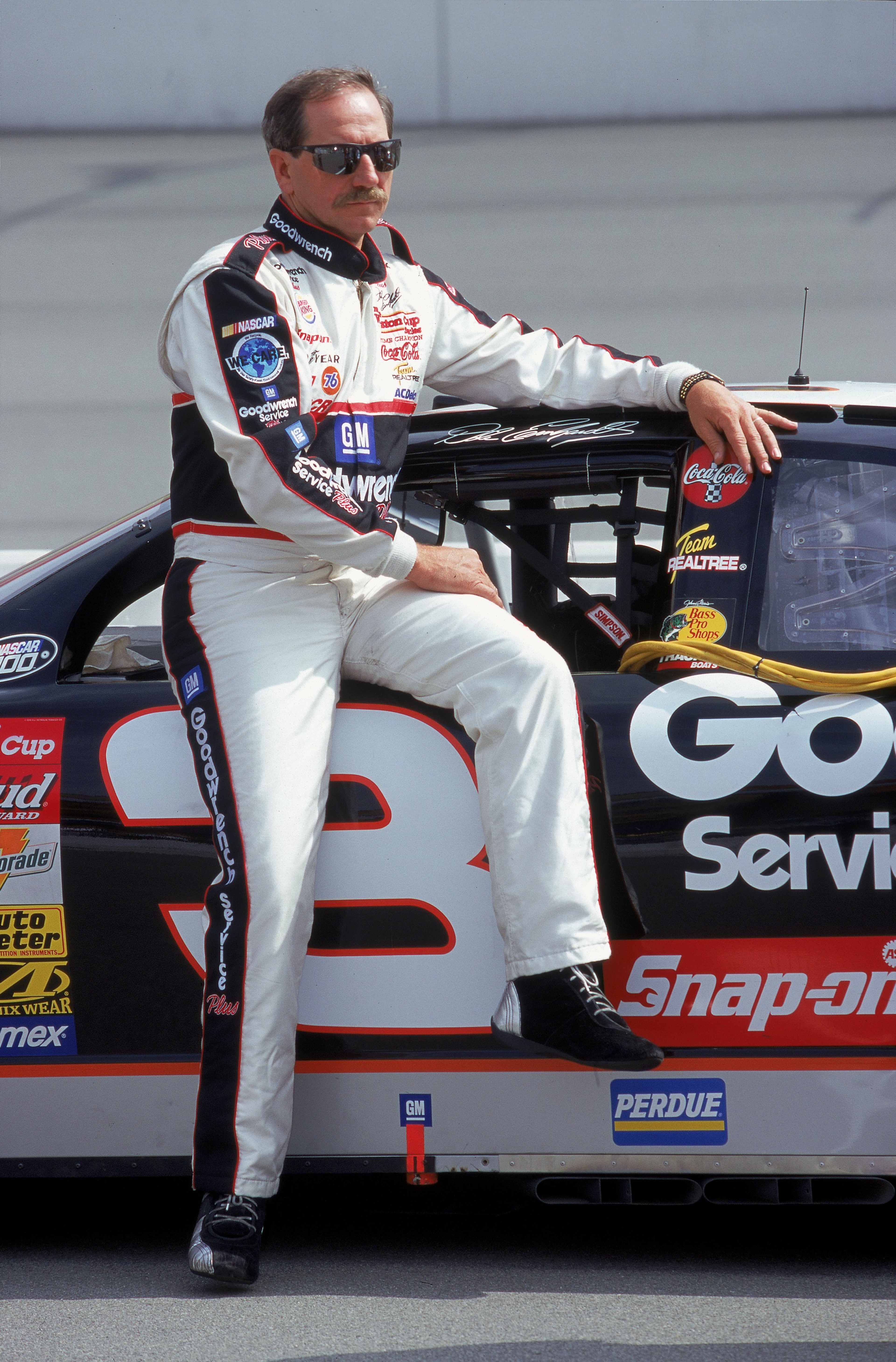 30 Apr 2000: Dale Earnhardt Sr. poses with his car during the NAPA Auto Parts 500, Part of the NASCAR Winston Cup Series, at the California Speedway in Fontana, California. Mandatory Credit: Jon Ferrey  /Allsport